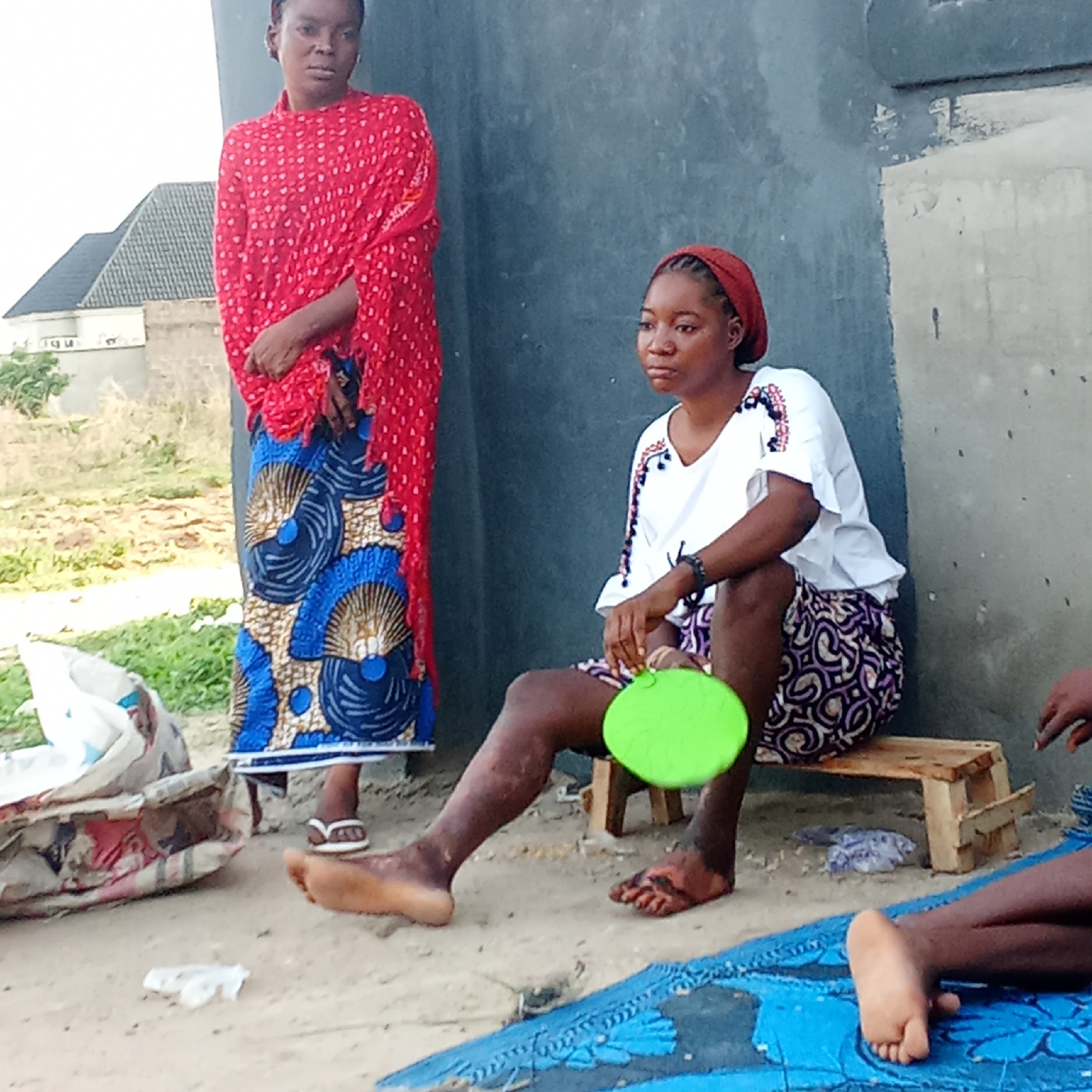 Women gather outdoors in Doma, Nigeria for daily activities