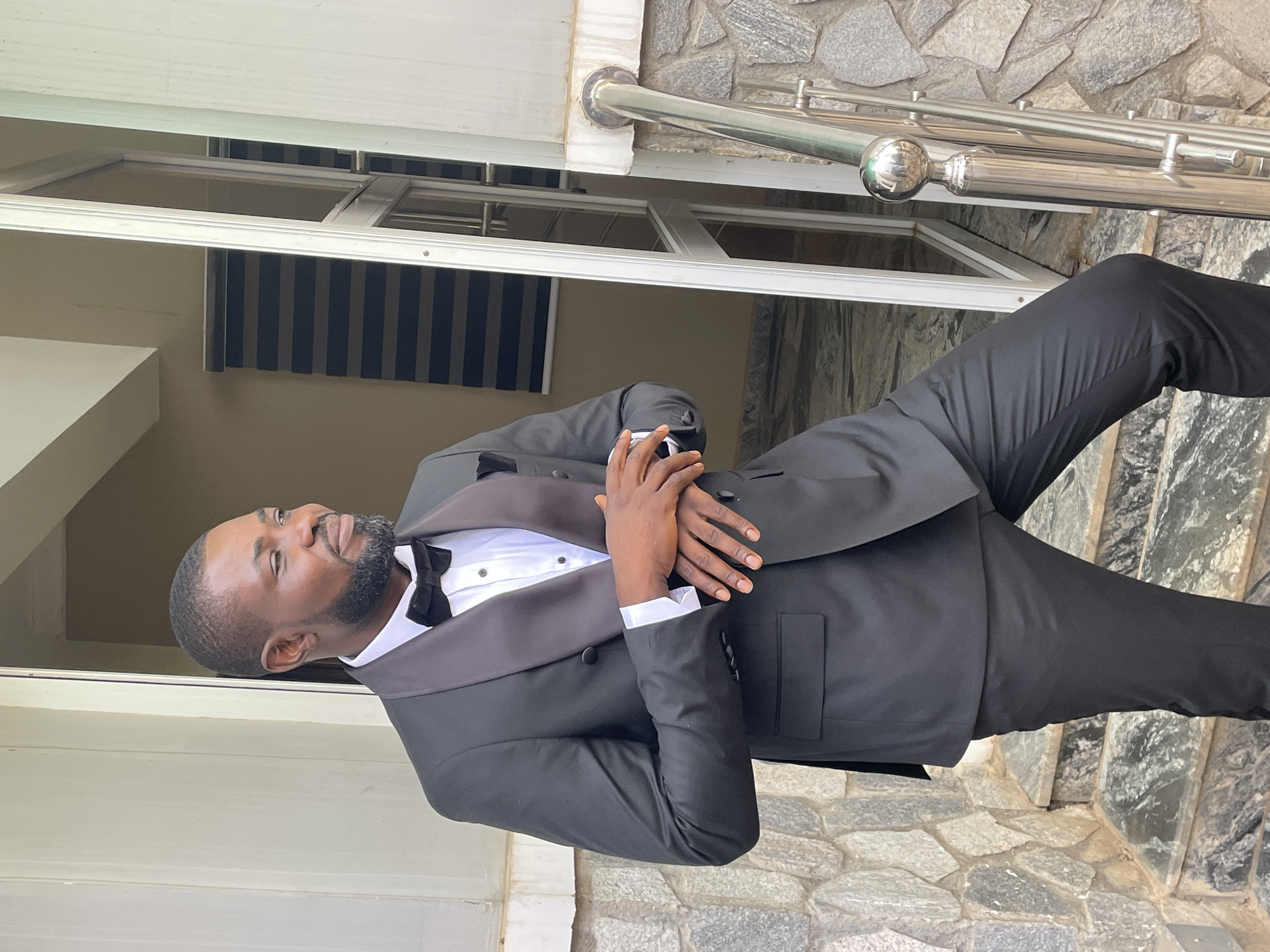 Formally dressed man spotted outside Bukuru building