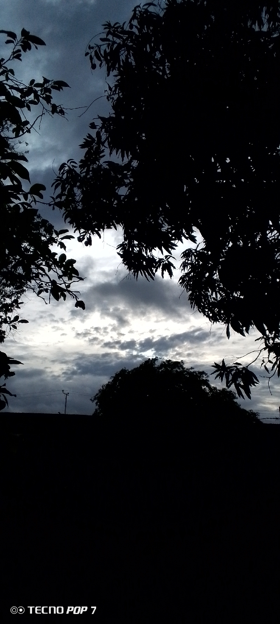 Storm clouds roll over Altagracia as evening sets in