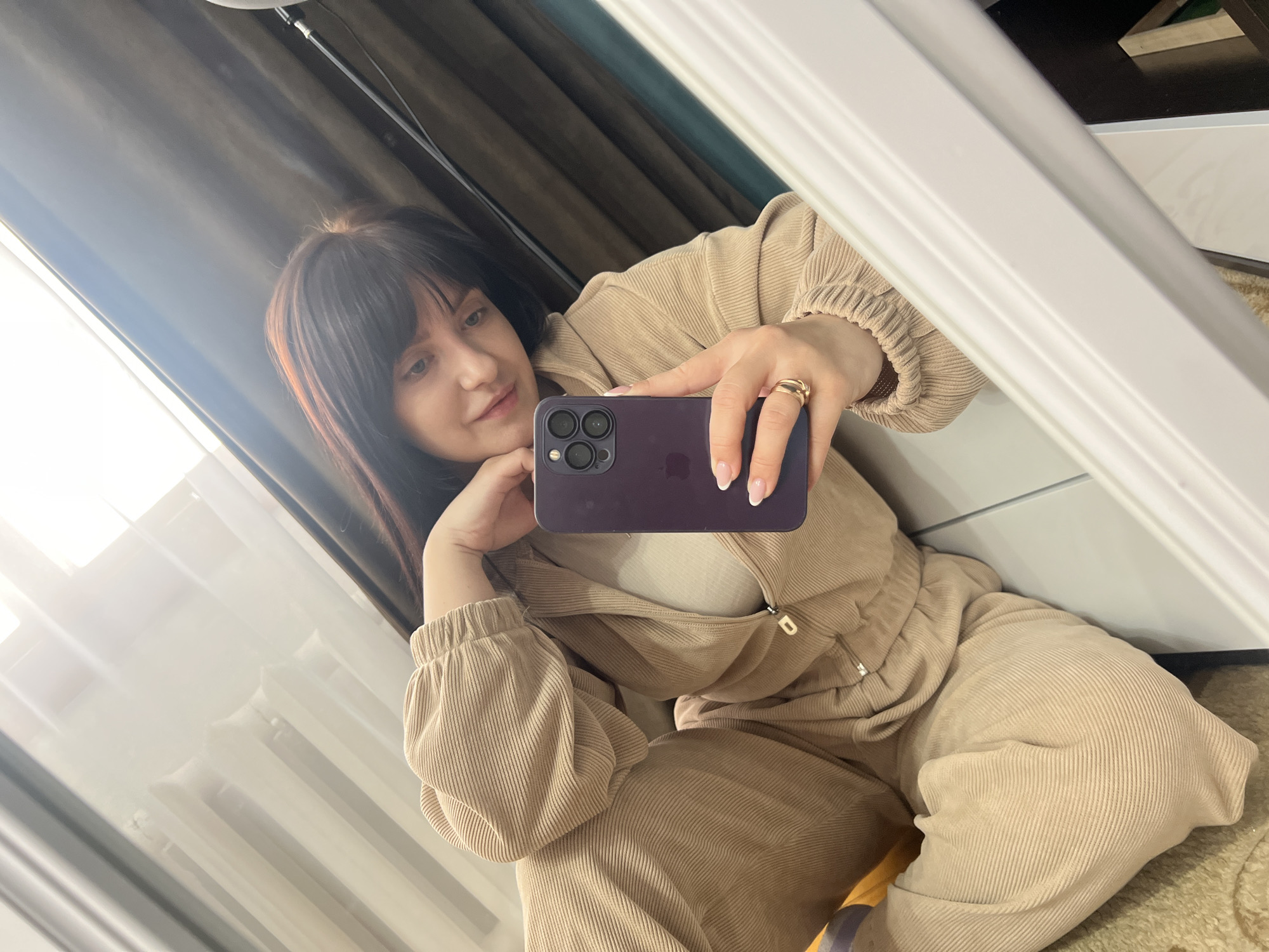 Woman takes morning selfies in Russian apartment building