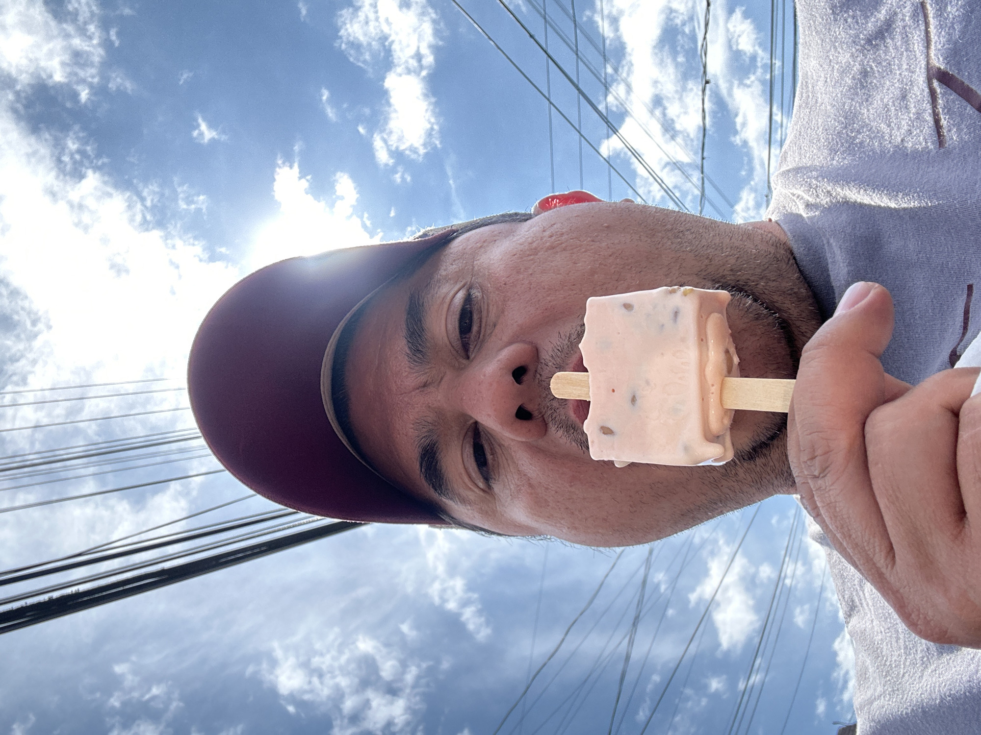Man enjoys popsicle outdoors in Chipilo, Mexico