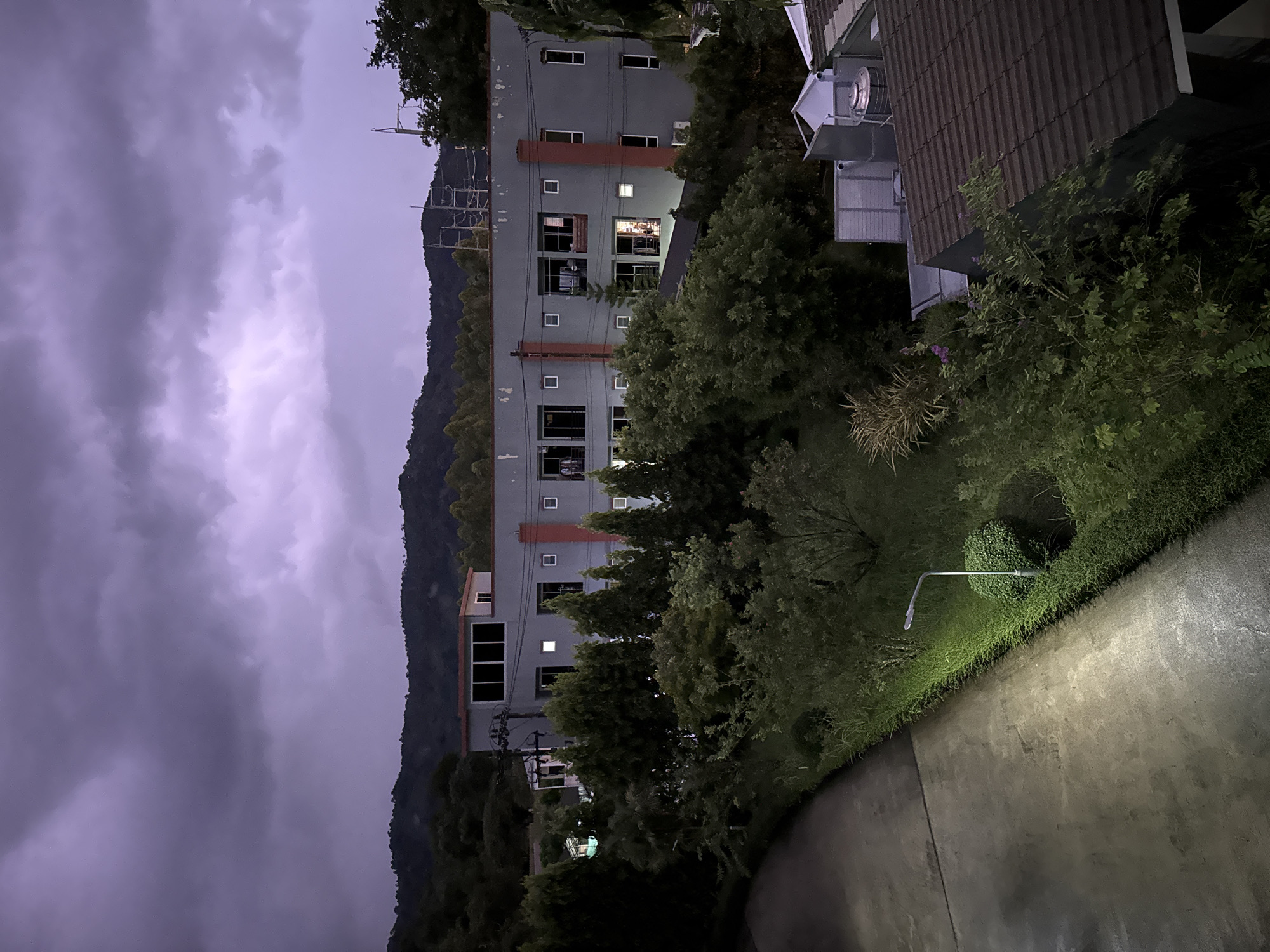Grey building photographed at night in Kathu, Thailand