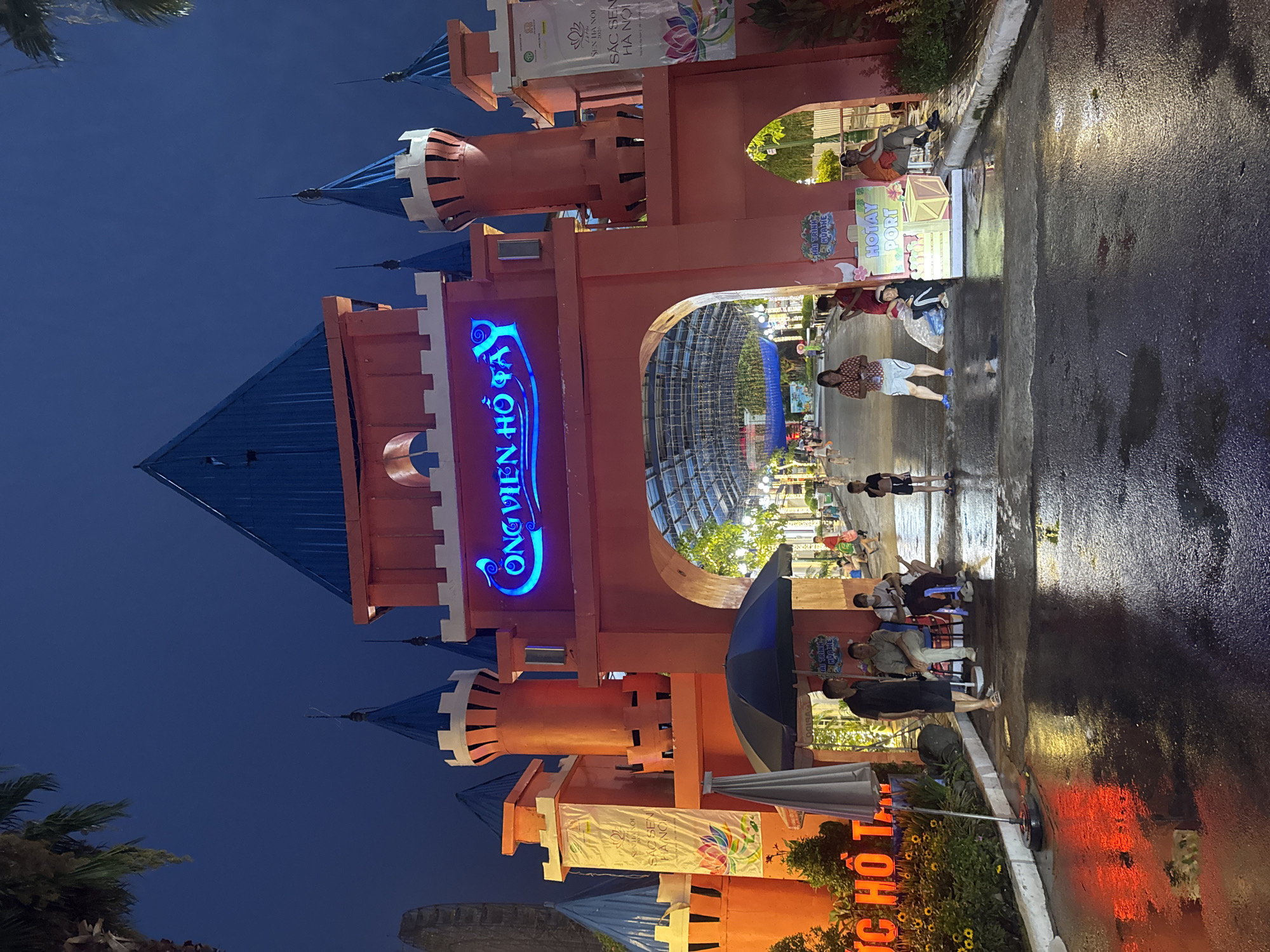 West Lake Park's illuminated castle entrance and surrounding nightlife.