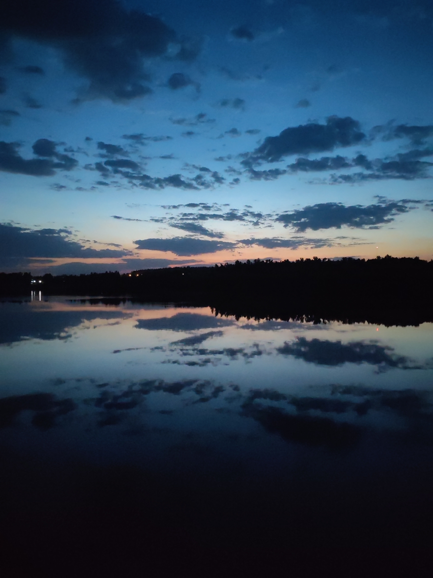 Twilight waterfront scenes documented in Ermolino, Russia