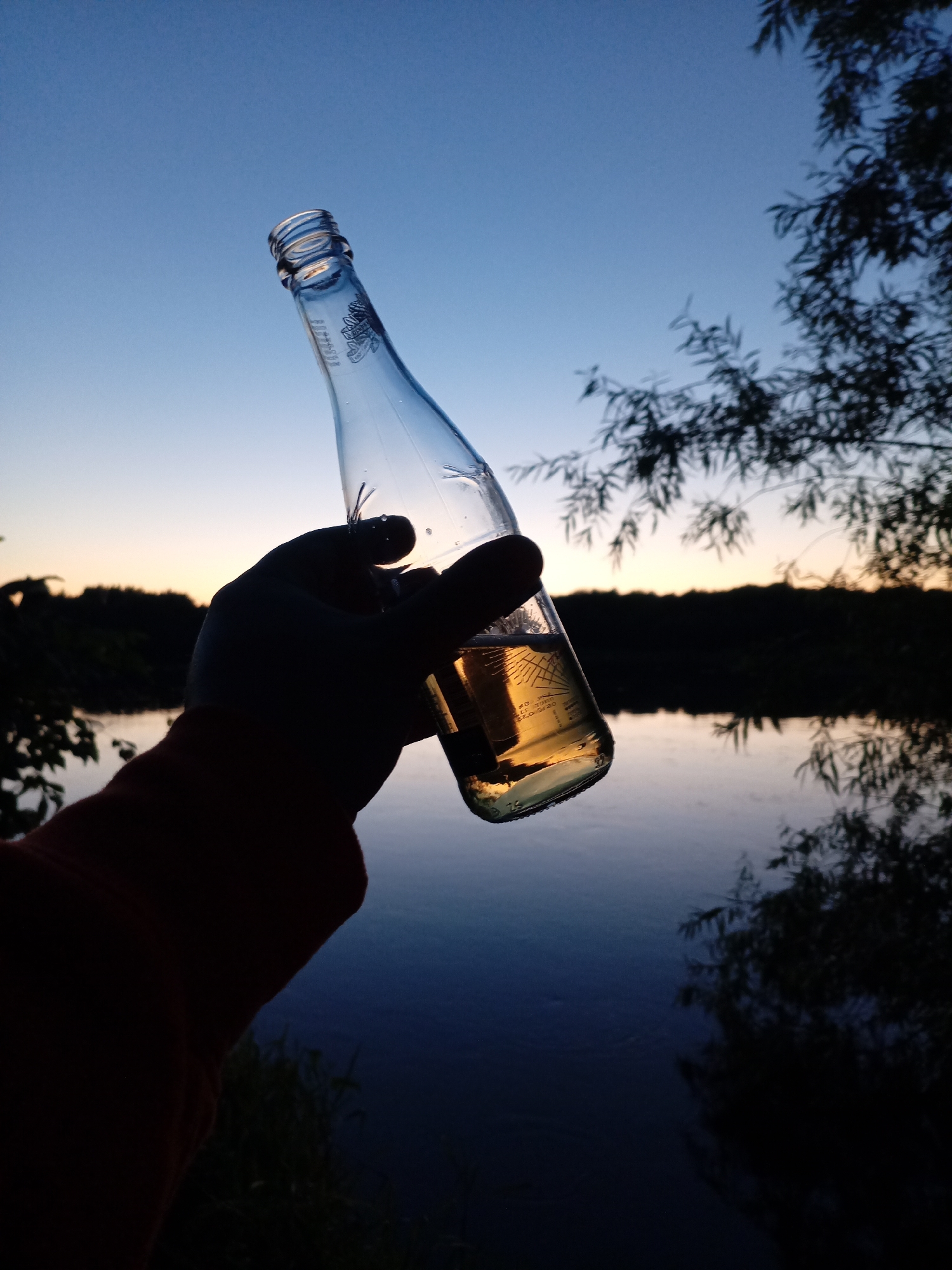 Beers by the river as the sun goes down