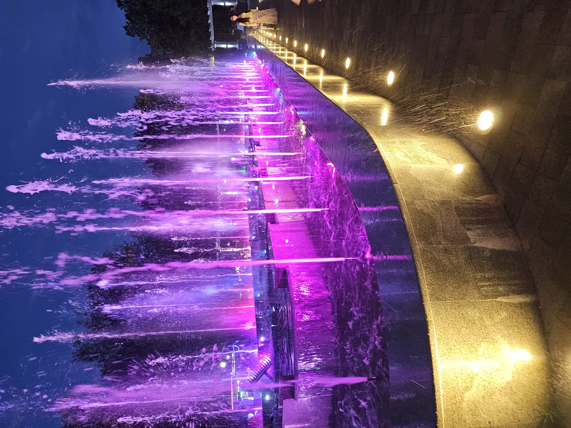 Cherkessk at dusk: lit fountains, churches, and city streets