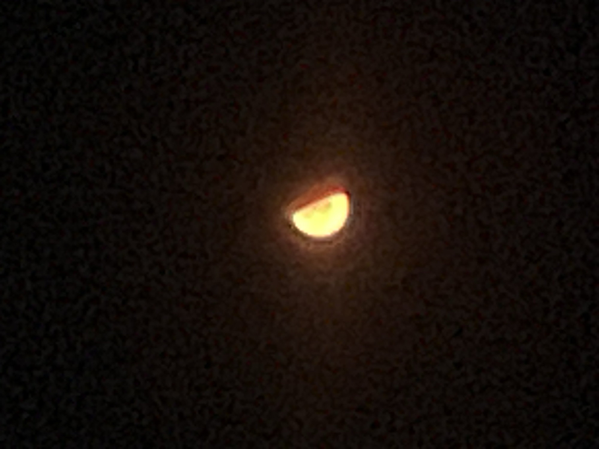 Orange moon rising over Obzor on a summer night