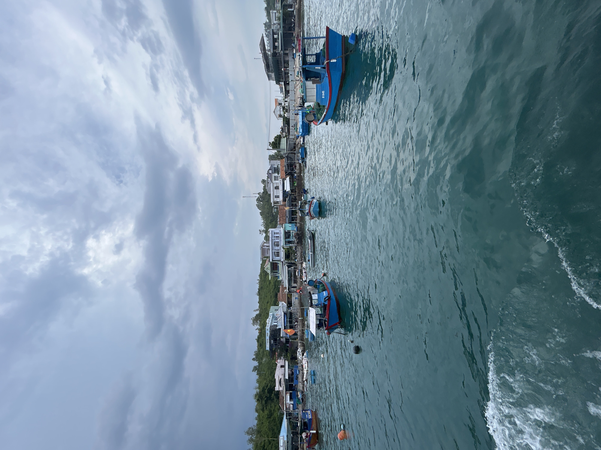 Fishing boats moored in Nha Trang's turquoise coastal waters