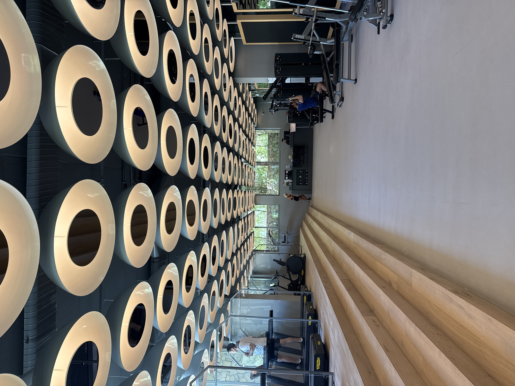 Inside a stylish Bodrum gym with standout circular ceiling lights