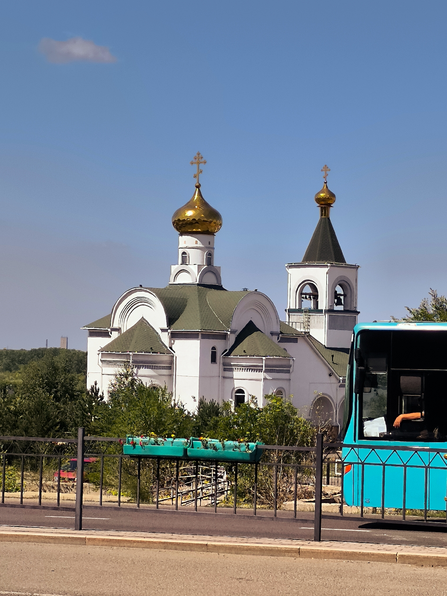 Sunny stop by a golden-domed church in Karaganda