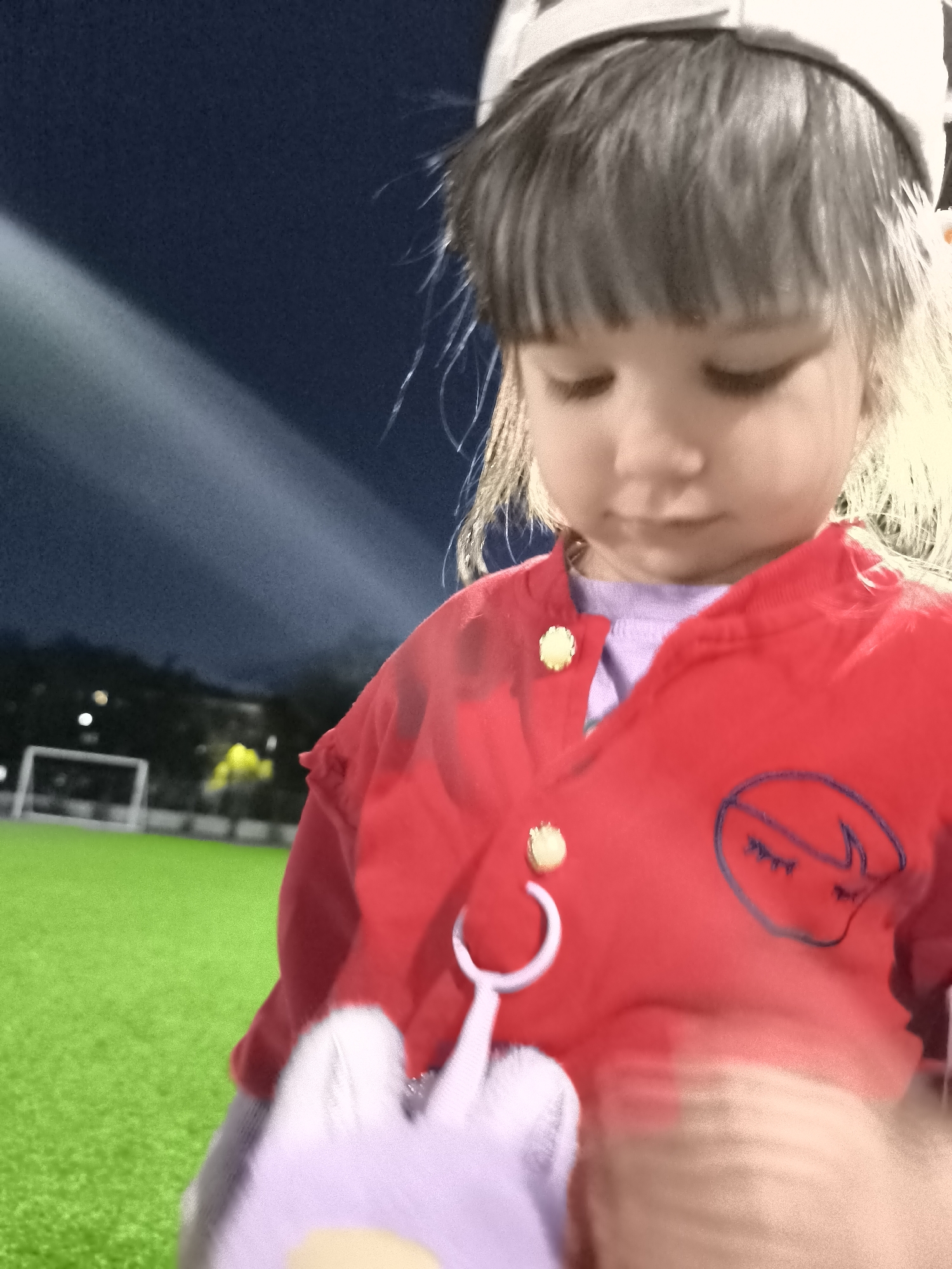 Evening moments on a turf field and wet pavement in Karaganda