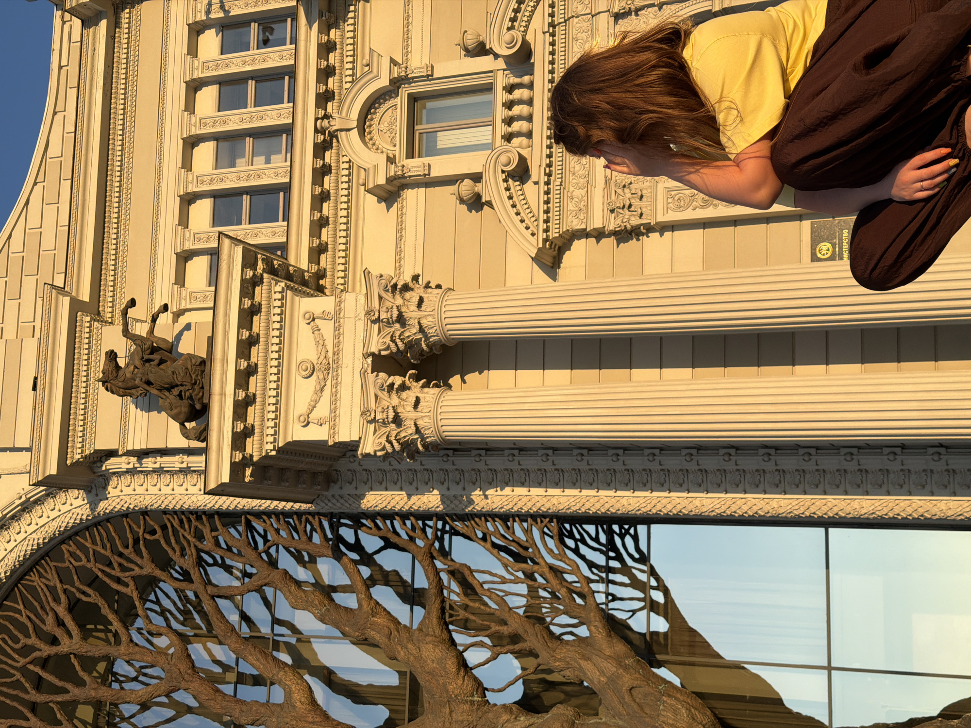 Tourists photograph Kazan landmarks during golden hour visit
