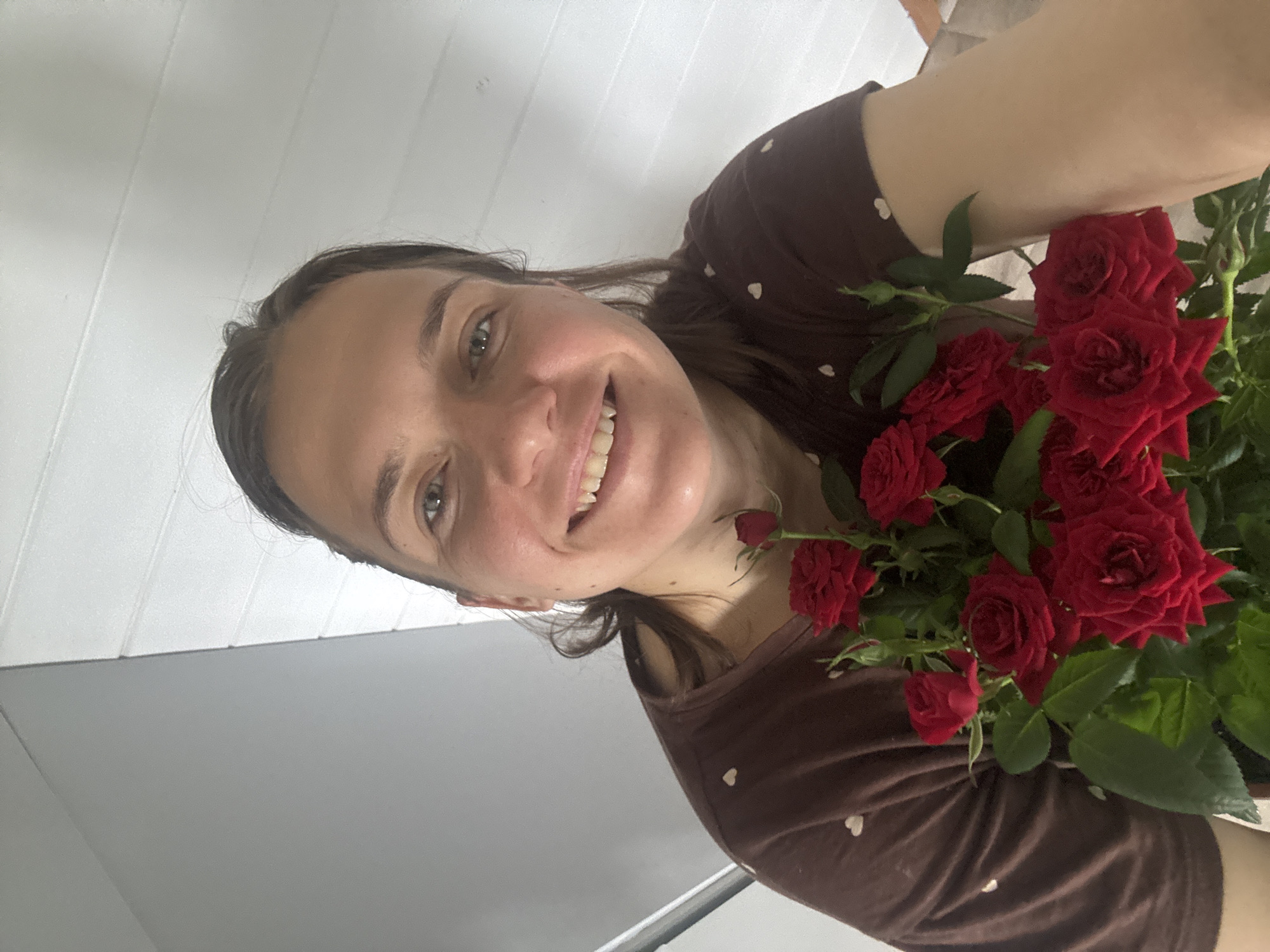 Woman with baby and roses captured in domestic moments