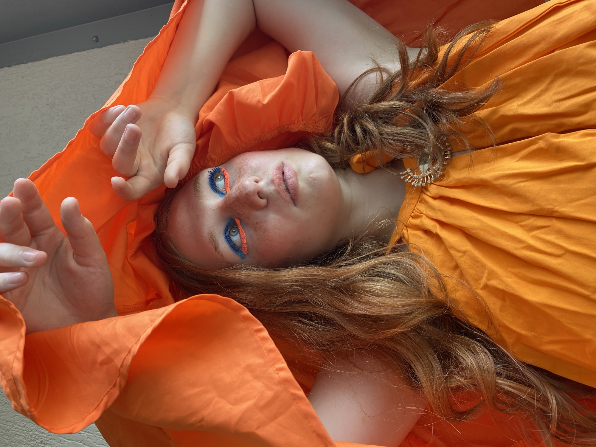 Bold orange fashion shoot on a Sochi balcony