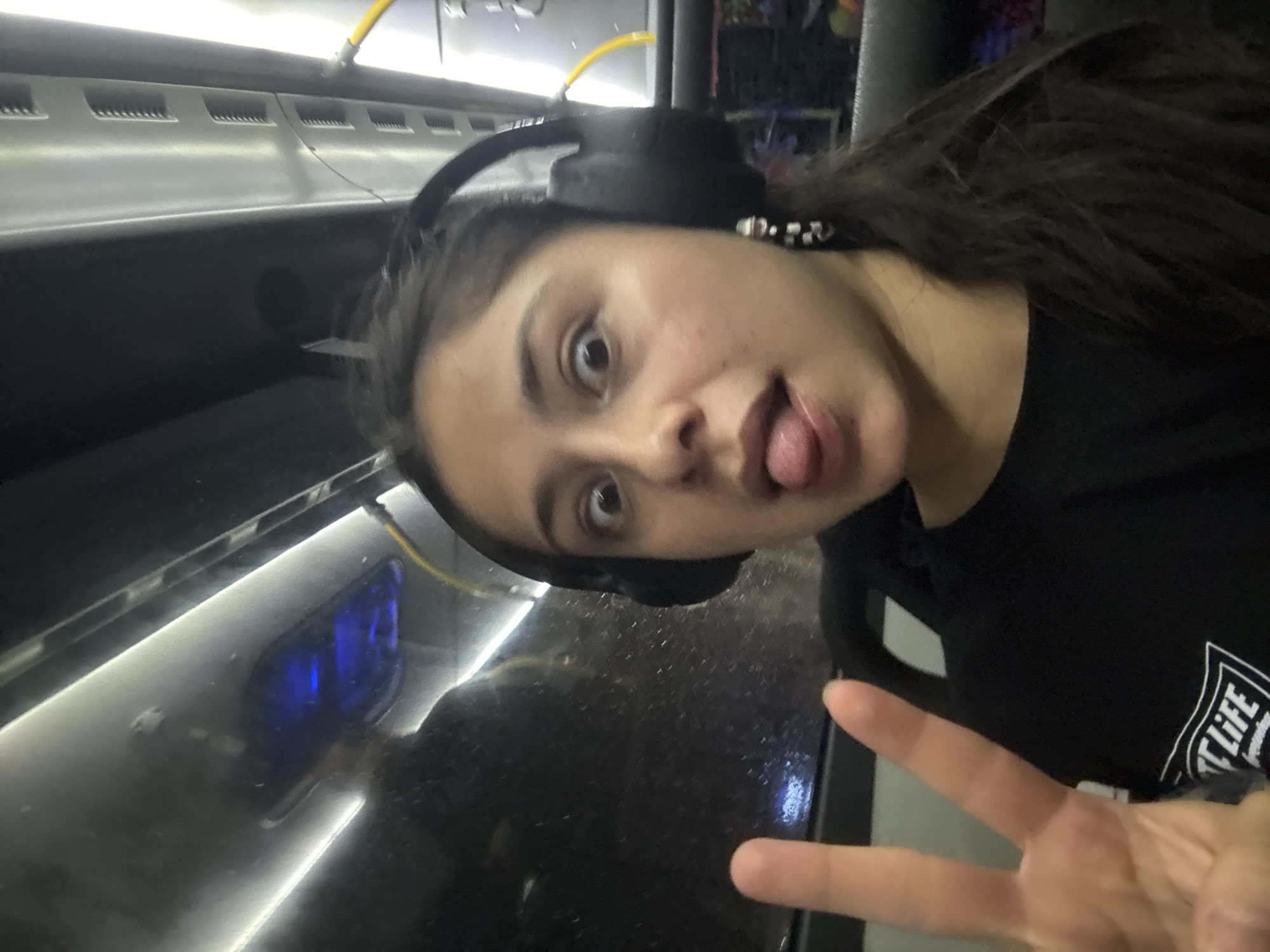Woman makes playful gestures on public transport in Perth