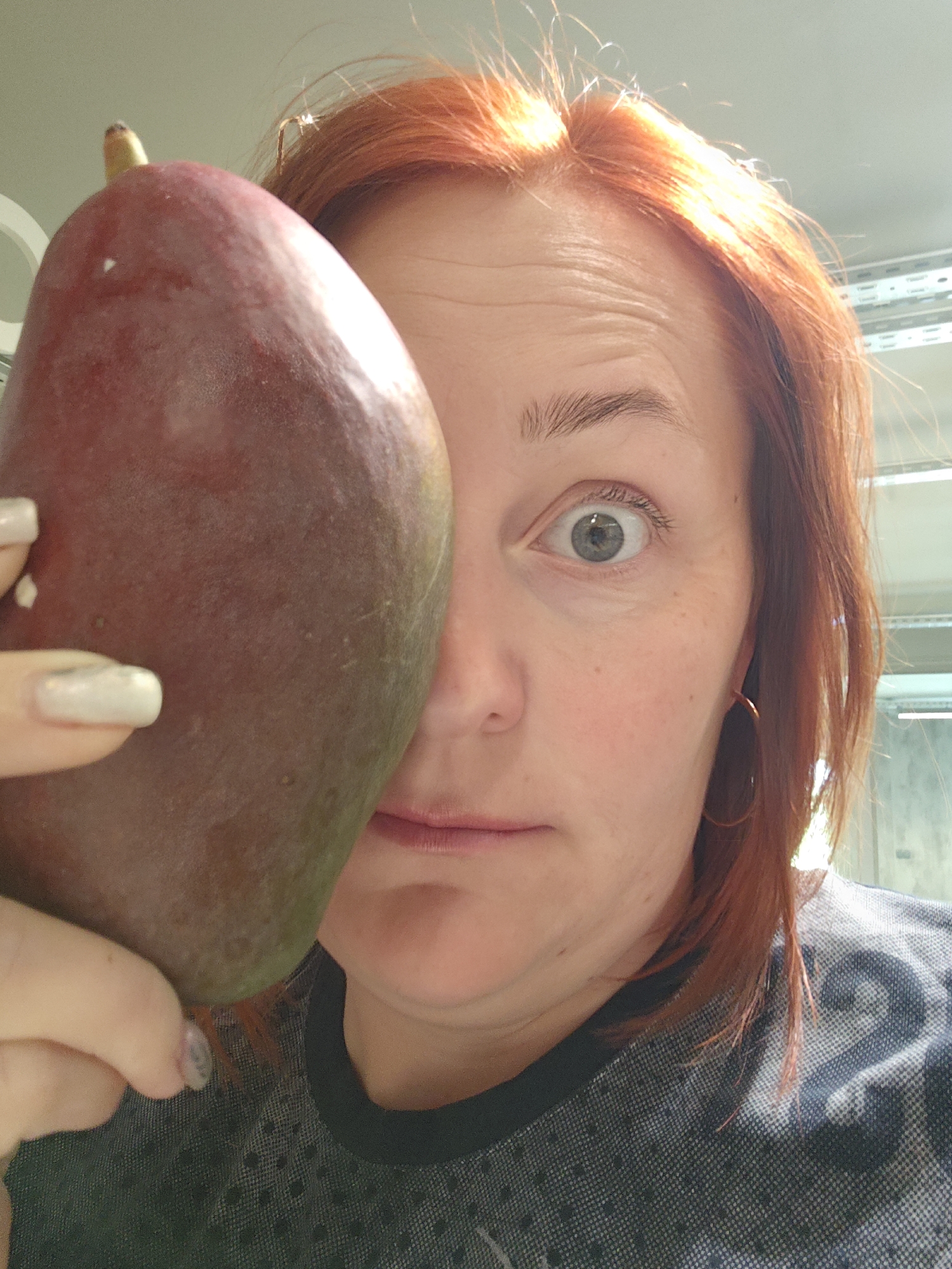Woman poses with large fruits in early morning Russia