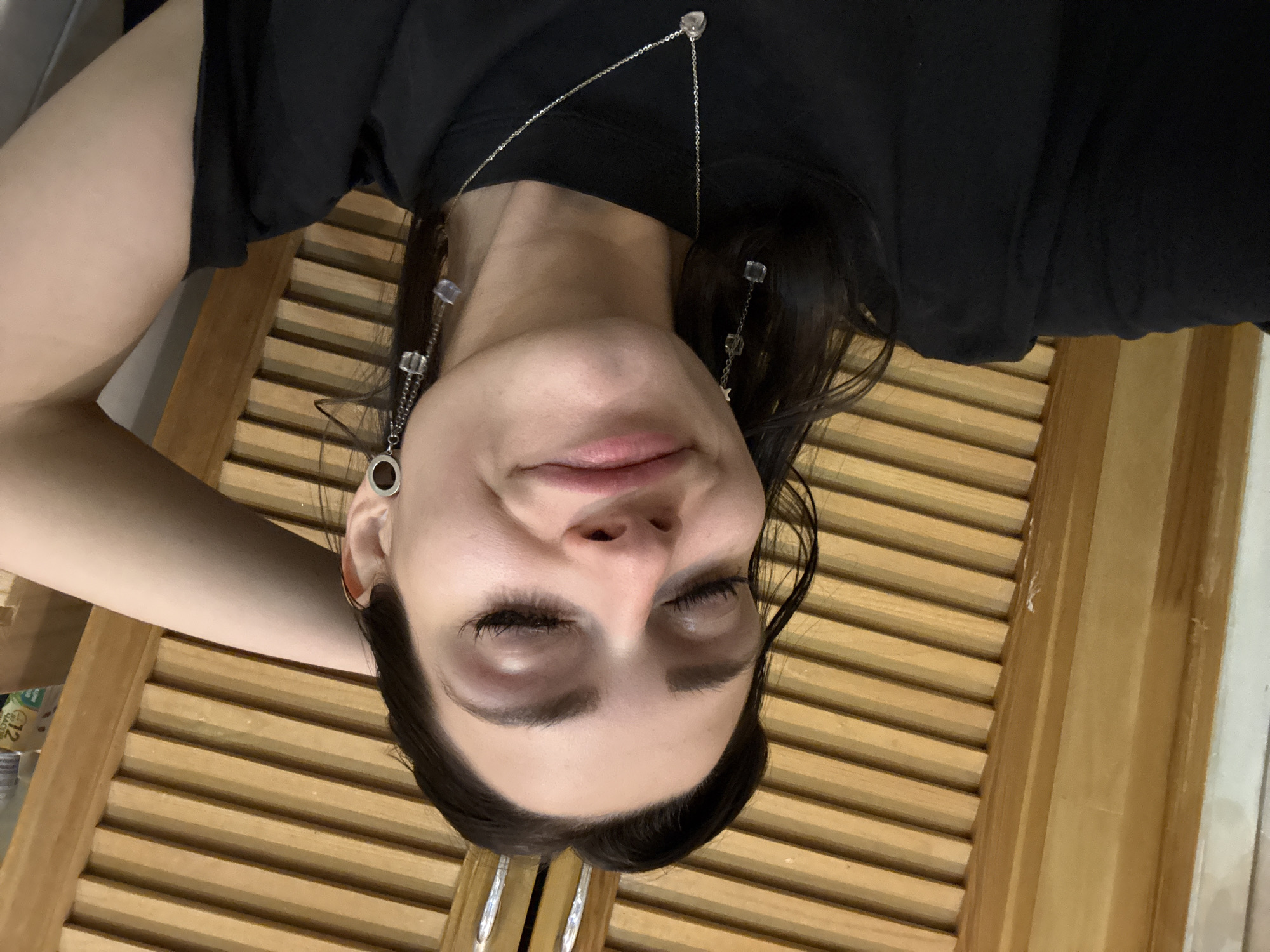 Woman rests on wooden surface in Reutov