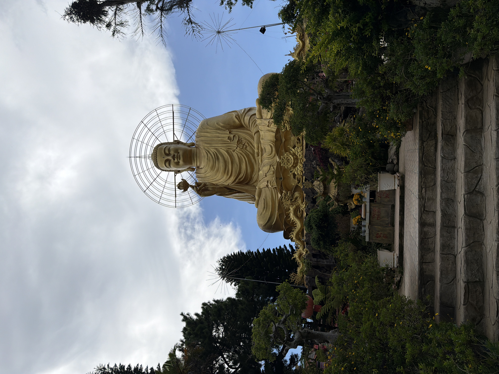 Buddhist temple complex in Đà Lạt: statues, gardens, and morning streets
