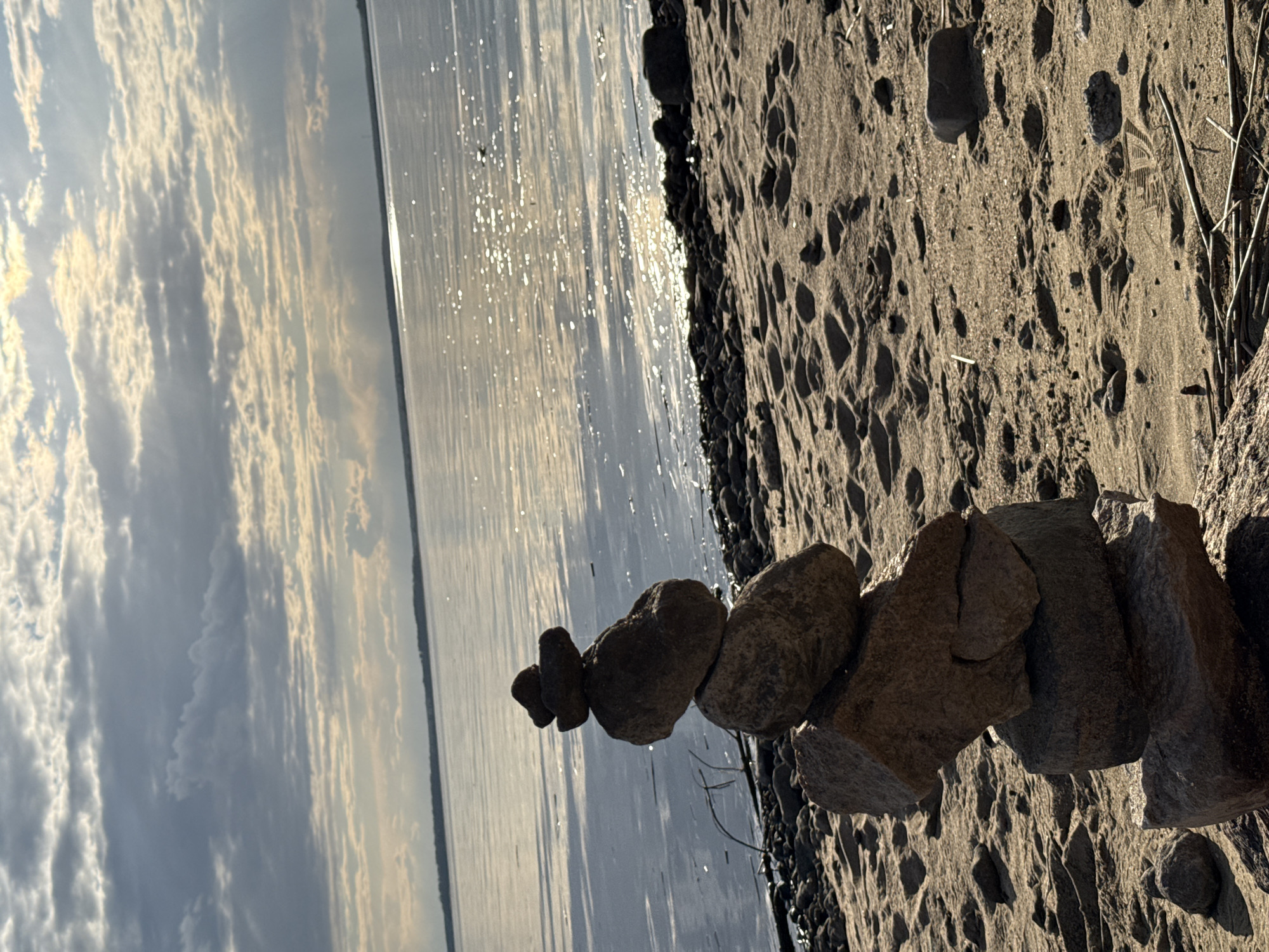Stone cairn built on Russian beach captured by witness