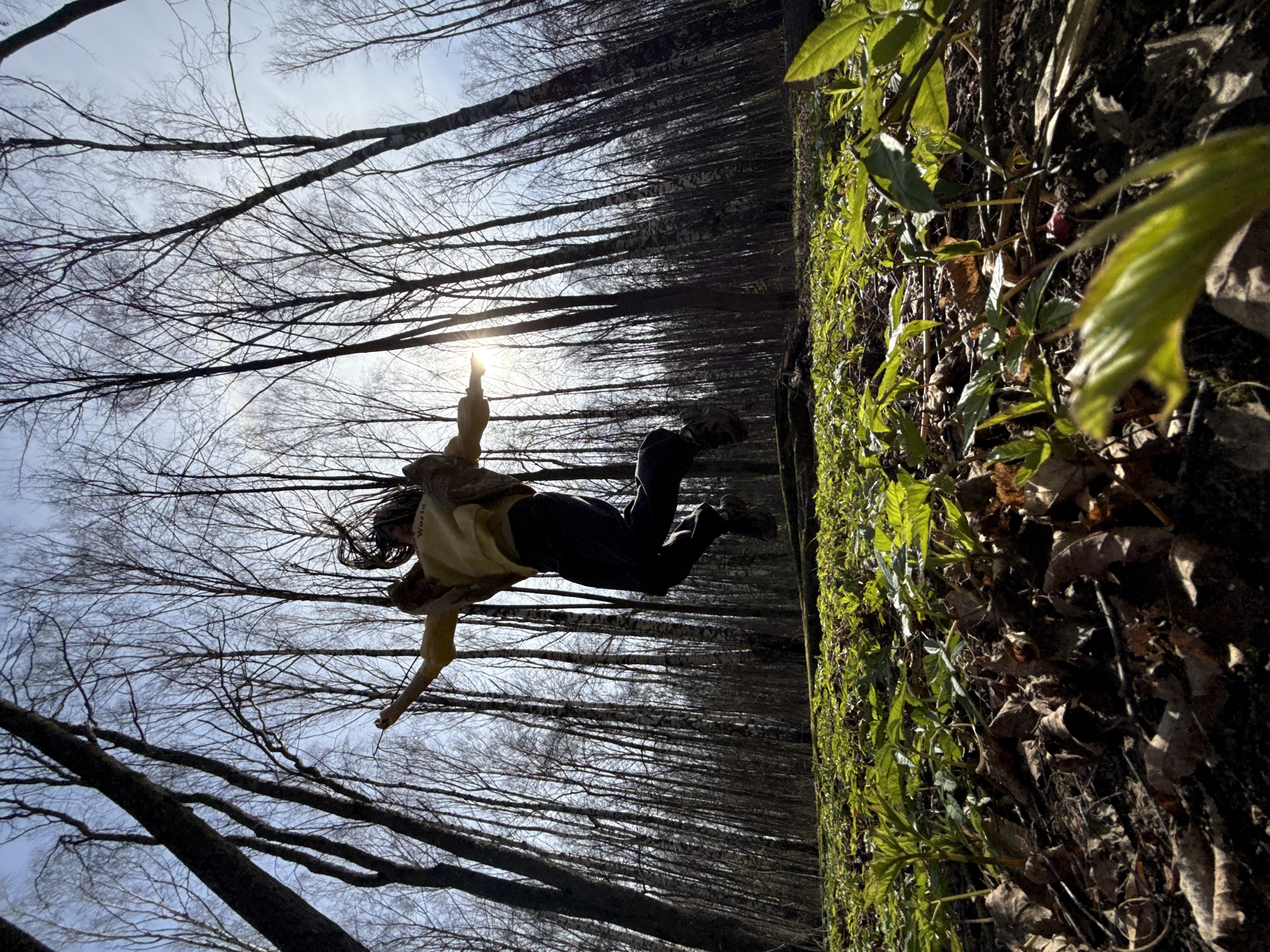 Forest photography session captures jumping, selfies, child portraits