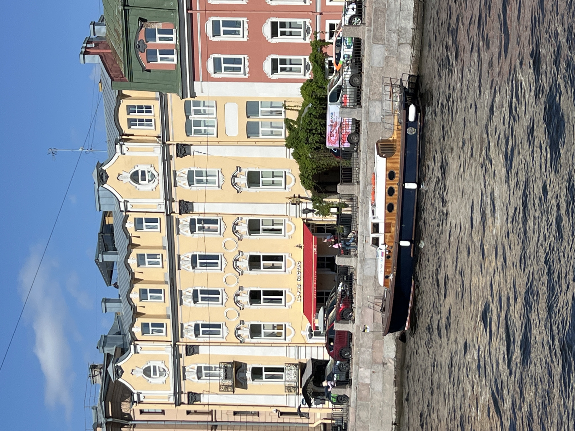 Man with garbage bag walks Saint Petersburg waterfront