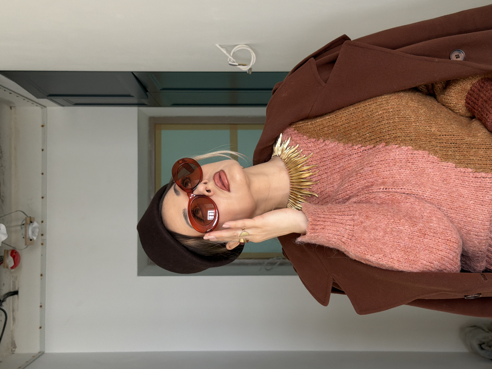 Woman in distinctive outfit photographed indoors in Krasnoyarsk