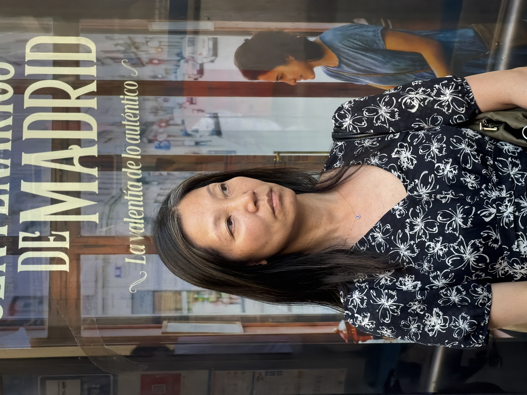 Street-level Madrid: storefronts and foot traffic on a summer evening
