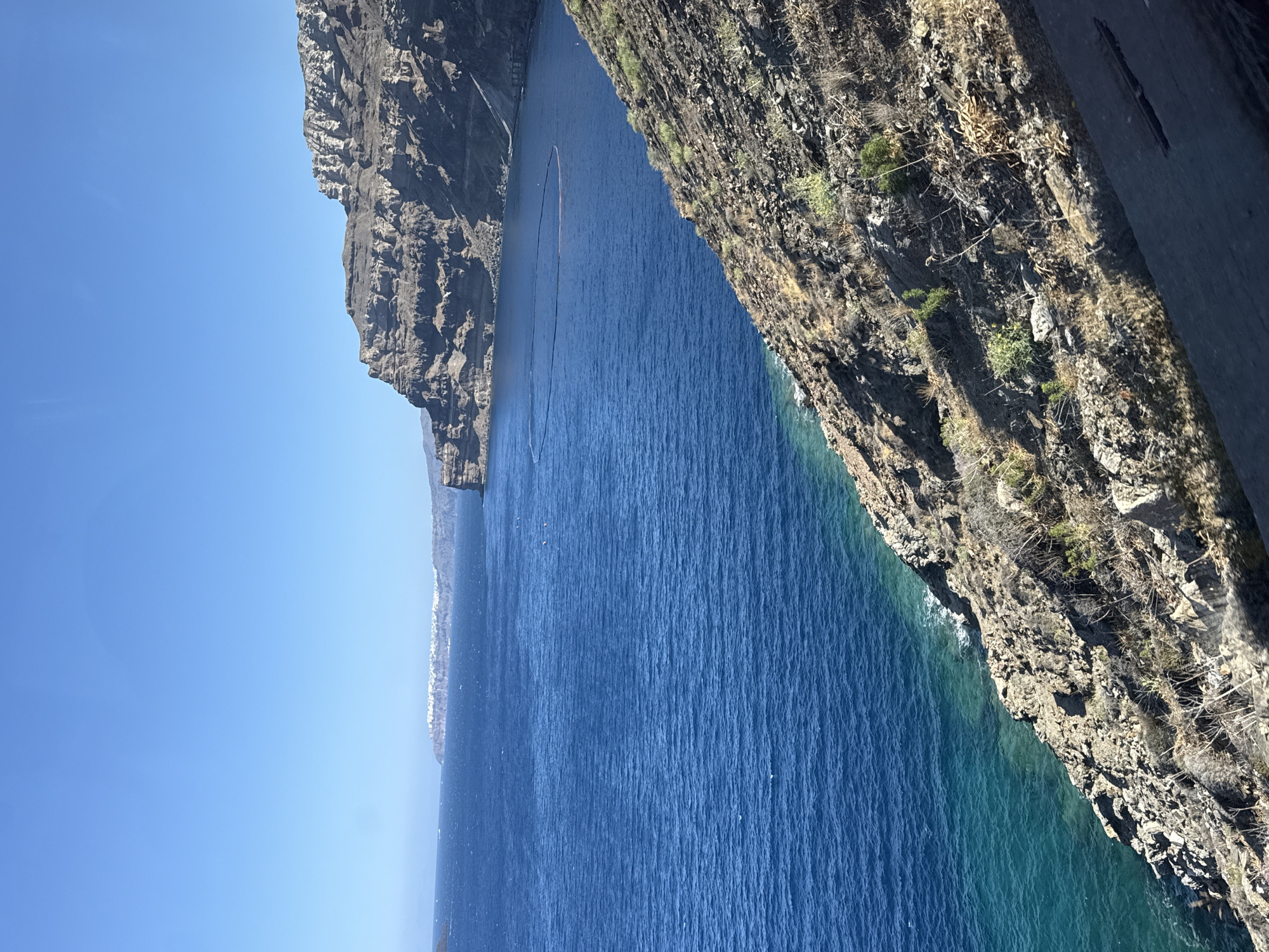 Santorini's cliffs and Aegean waters from two angles
