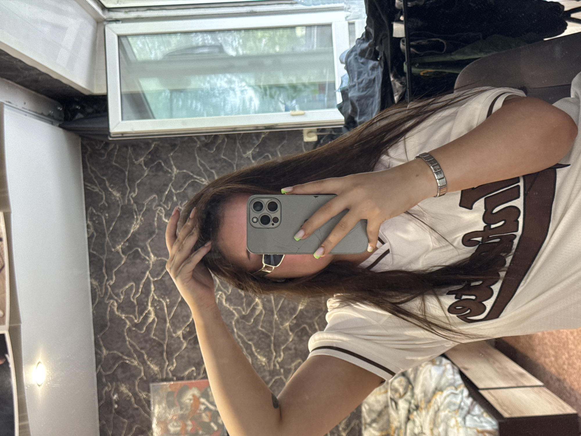 Mirror selfie session in a Novokuznetsk bedroom, mid-morning