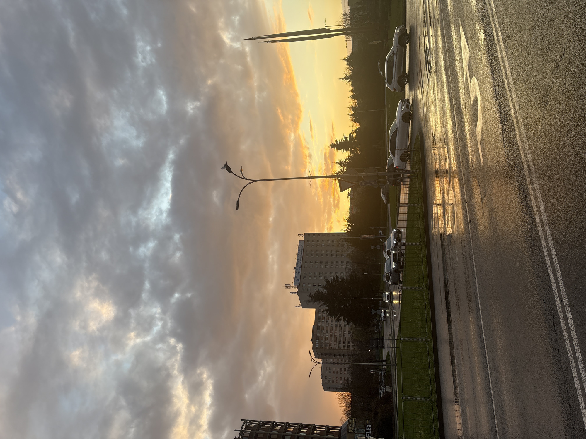 Sunset reflects on wet street in Burgas, Bulgaria
