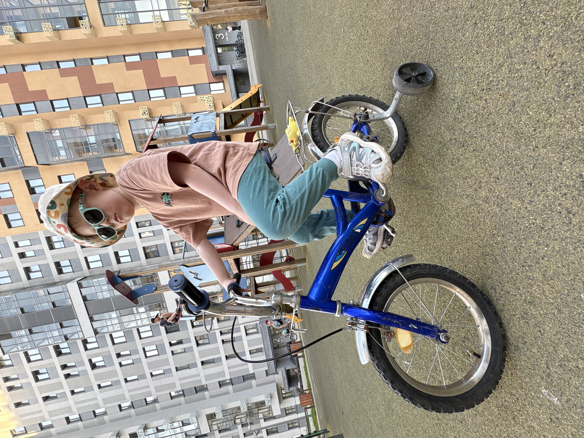 Outdoor recreation observed in Izhevsk: child cycling, forest trail