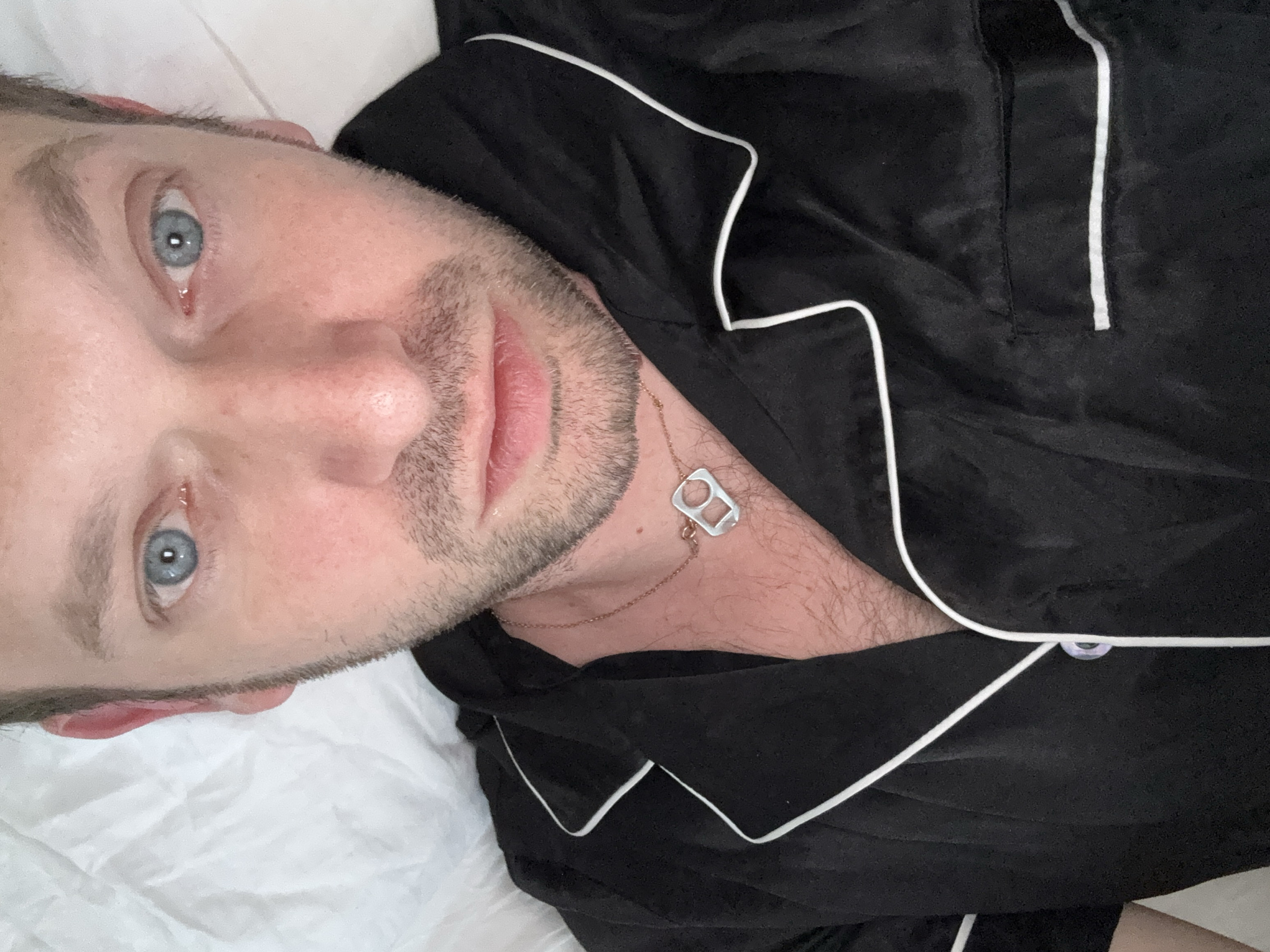 Man photographed resting on bed in Erba, Italy