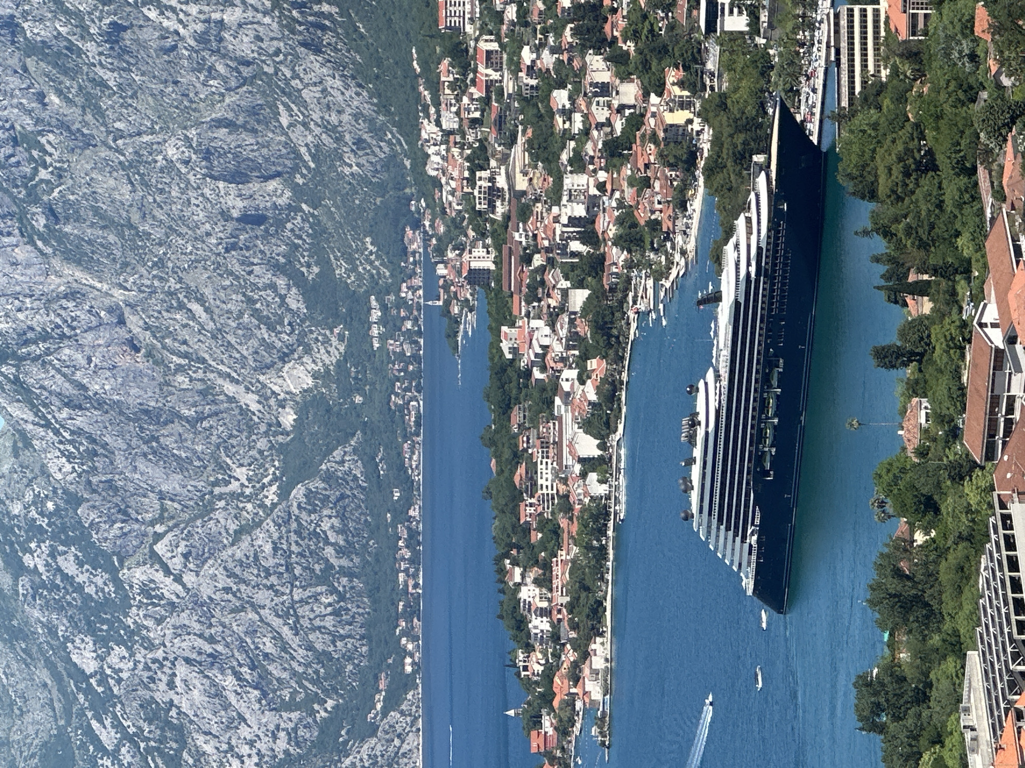 Tourists document cruise ship visit to Montenegro's Bay of Kotor