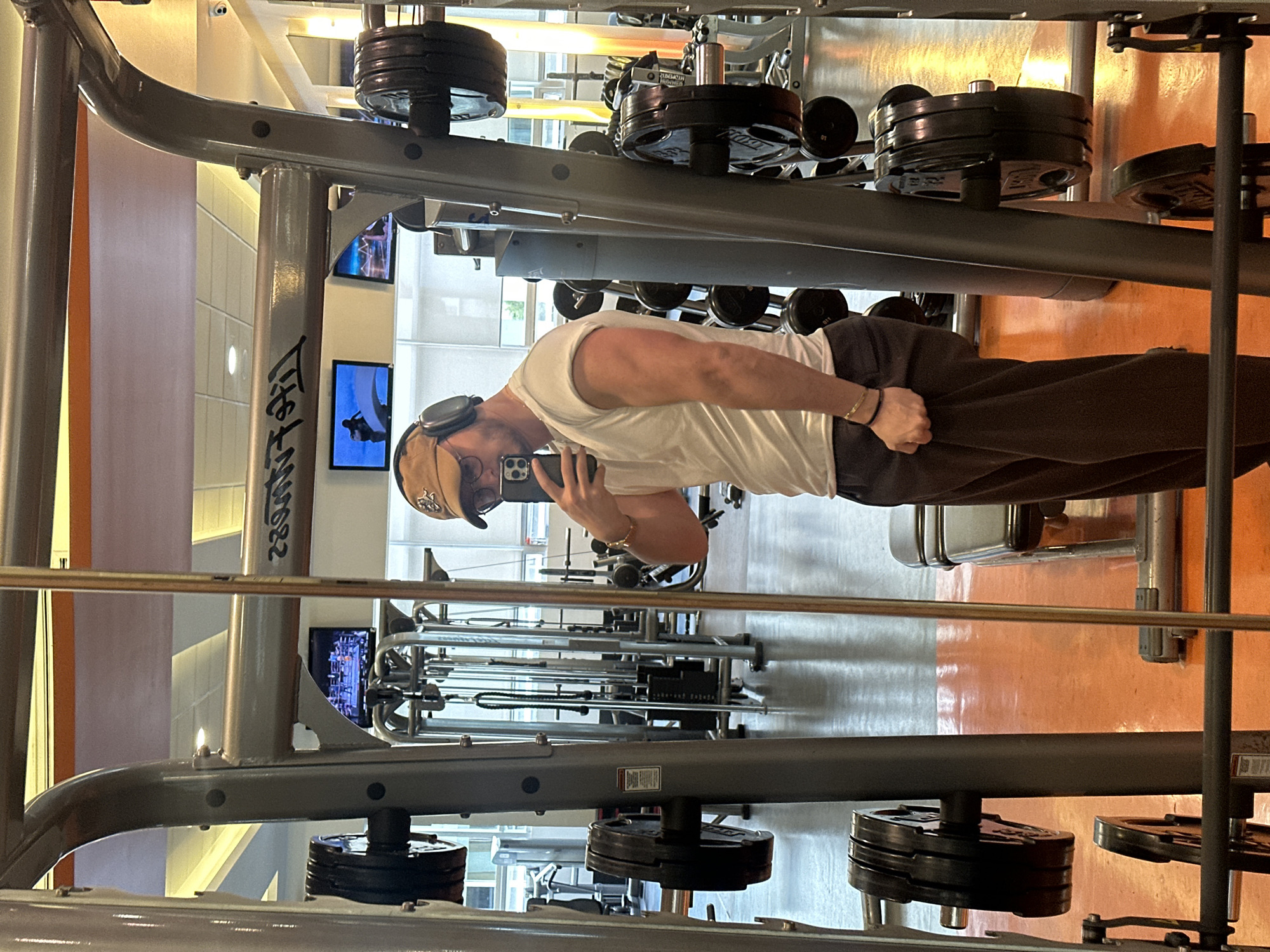 Gym-goer takes smartphone photo during workout session