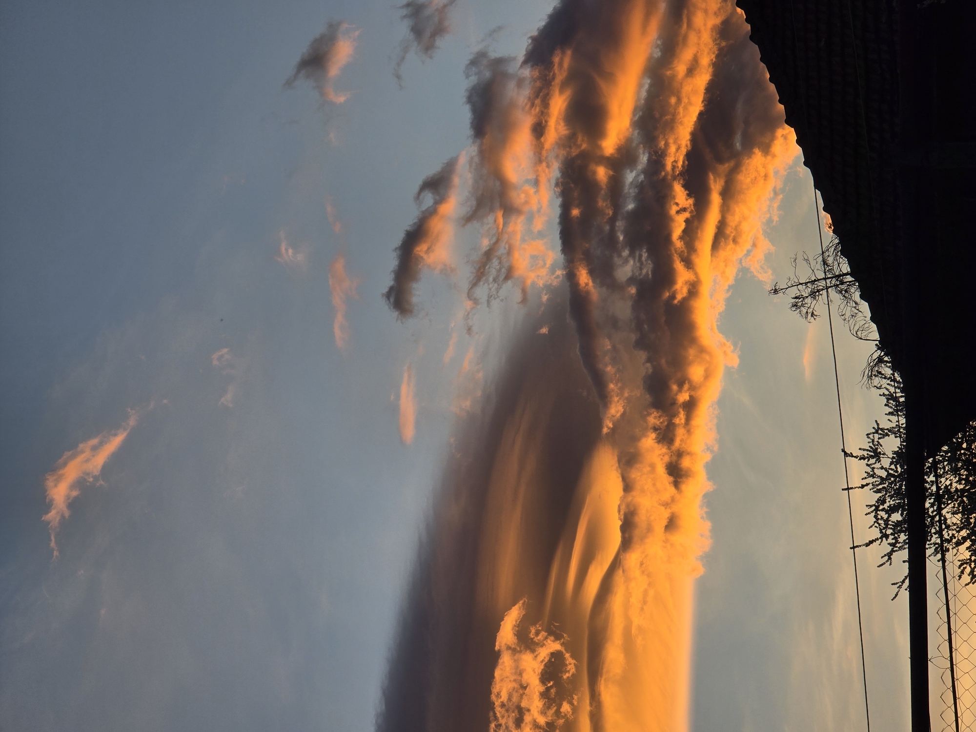 Dramatic lenticular cloud formation illuminates sunset over Berkovitsa, Bulgaria