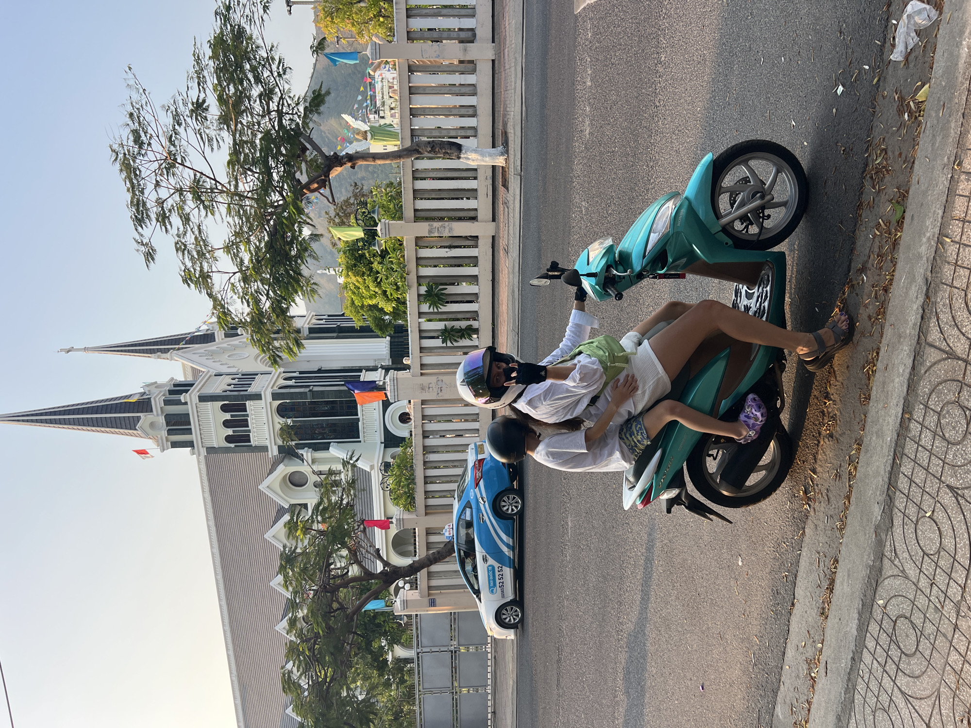 Motorbike riders and improvised bird cage spotted in Vietnam