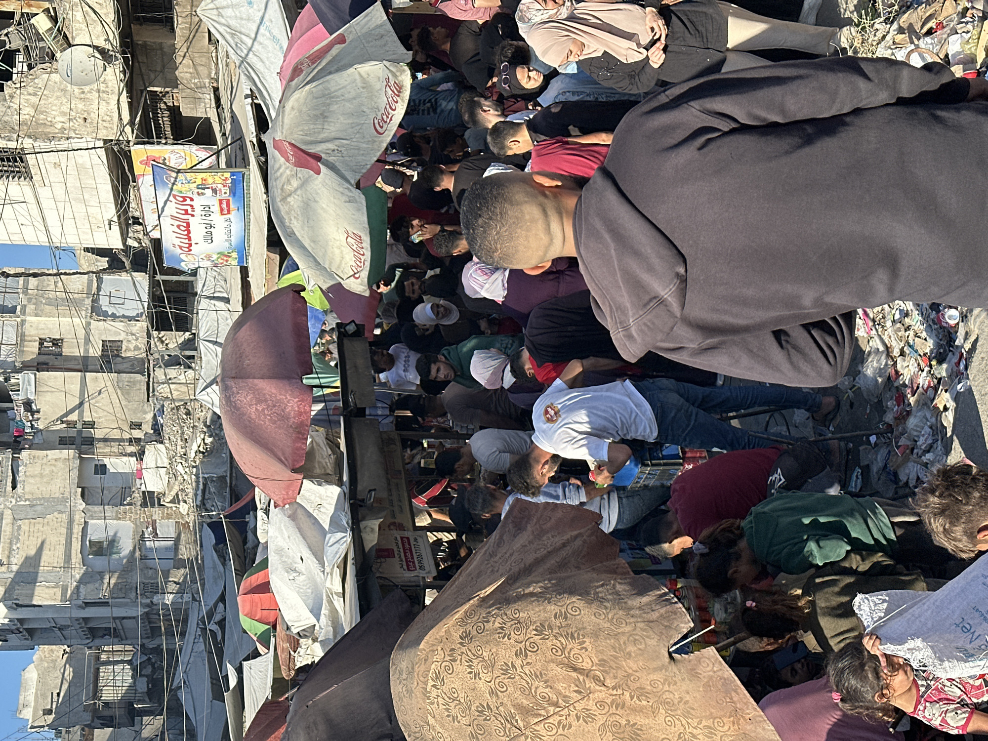 Busy marketplace operates in Gaza City amid urban setting