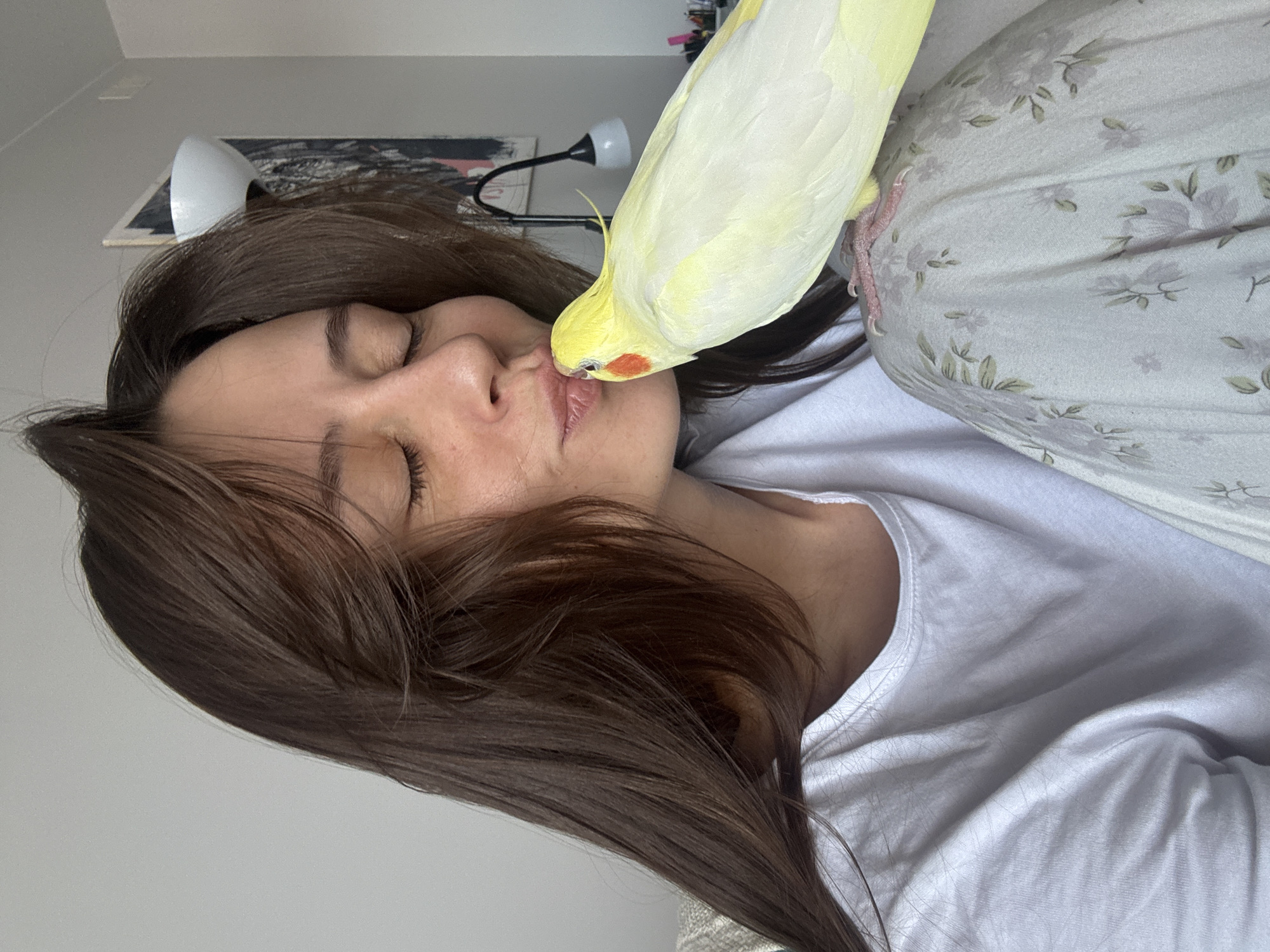 Woman shares tender moments with pet cockatiel in Krasnoyarsk home