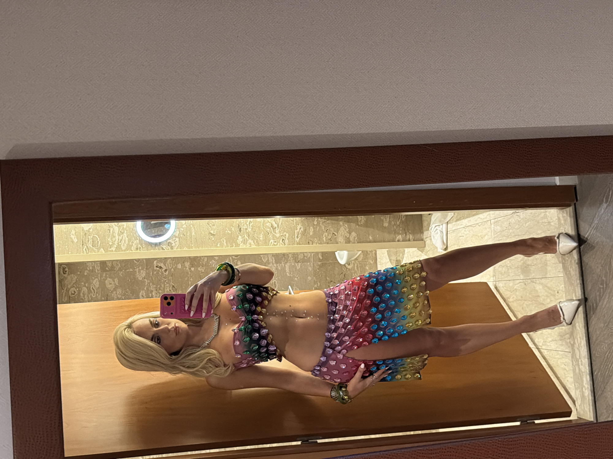 Woman takes mirror selfie in Barcelona hotel room