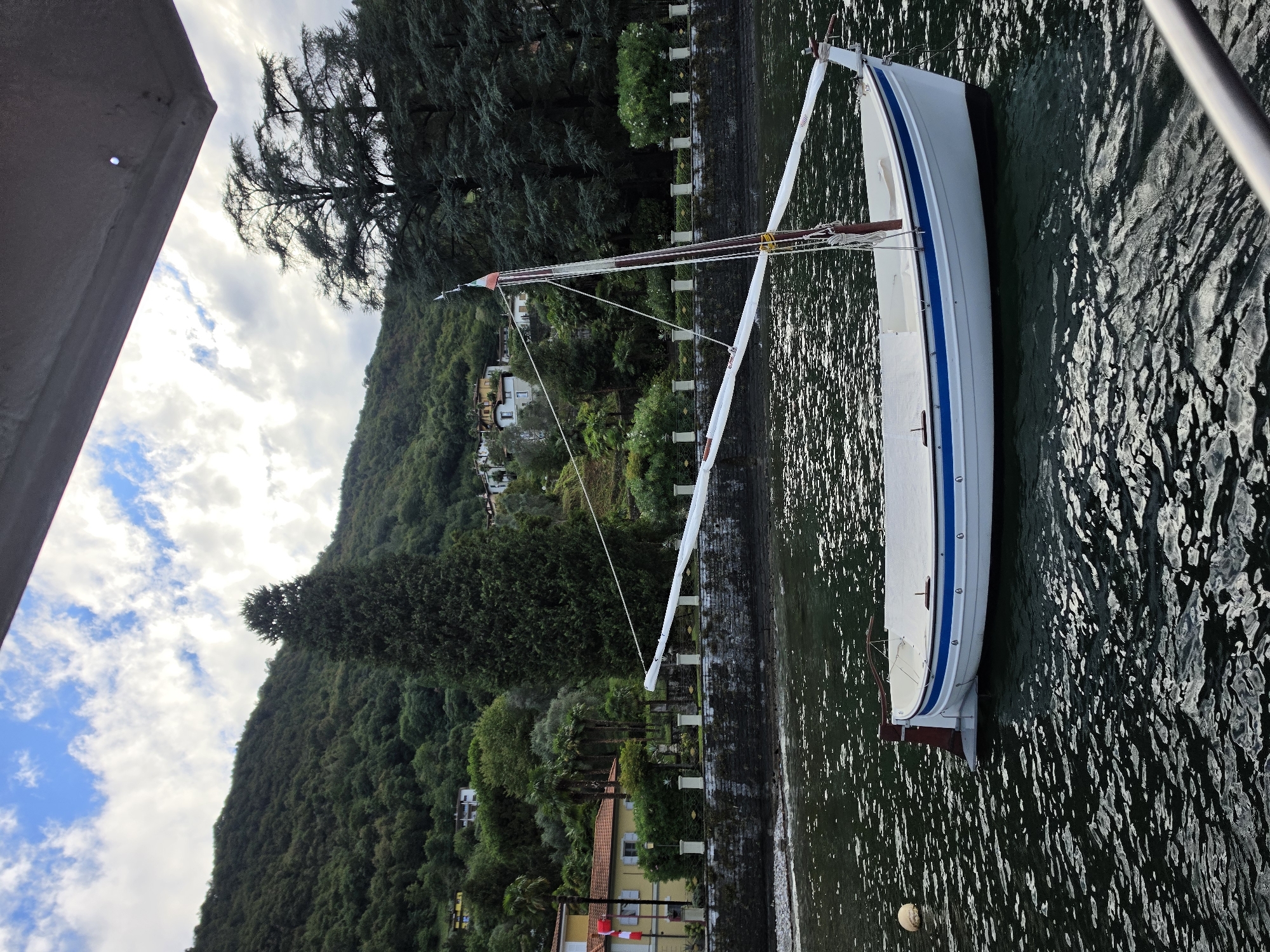 Sailboat moored on Lake Como at Oliveto Lario
