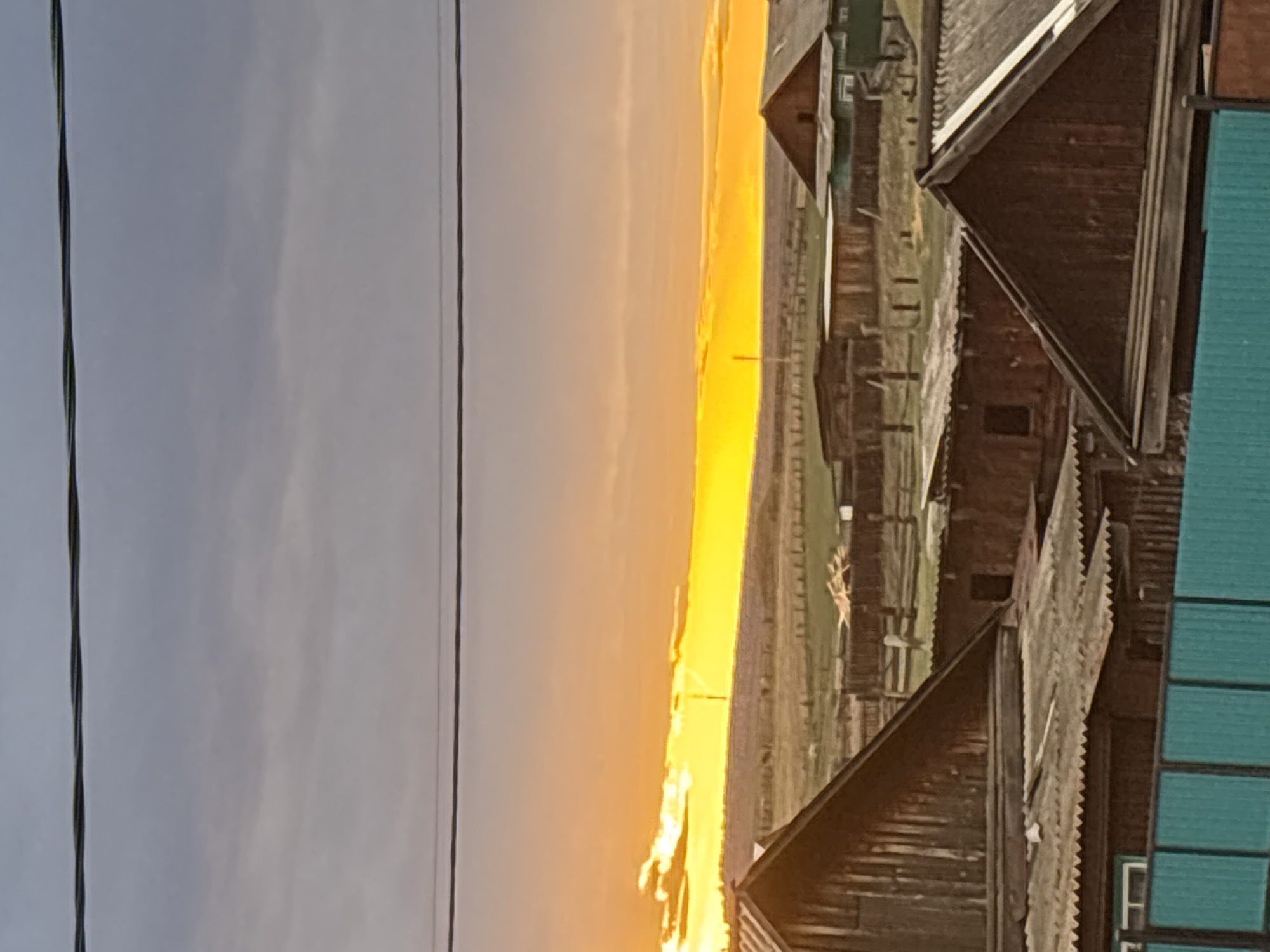 Sunset and ski storage captured in rural Zagatuy, Russia