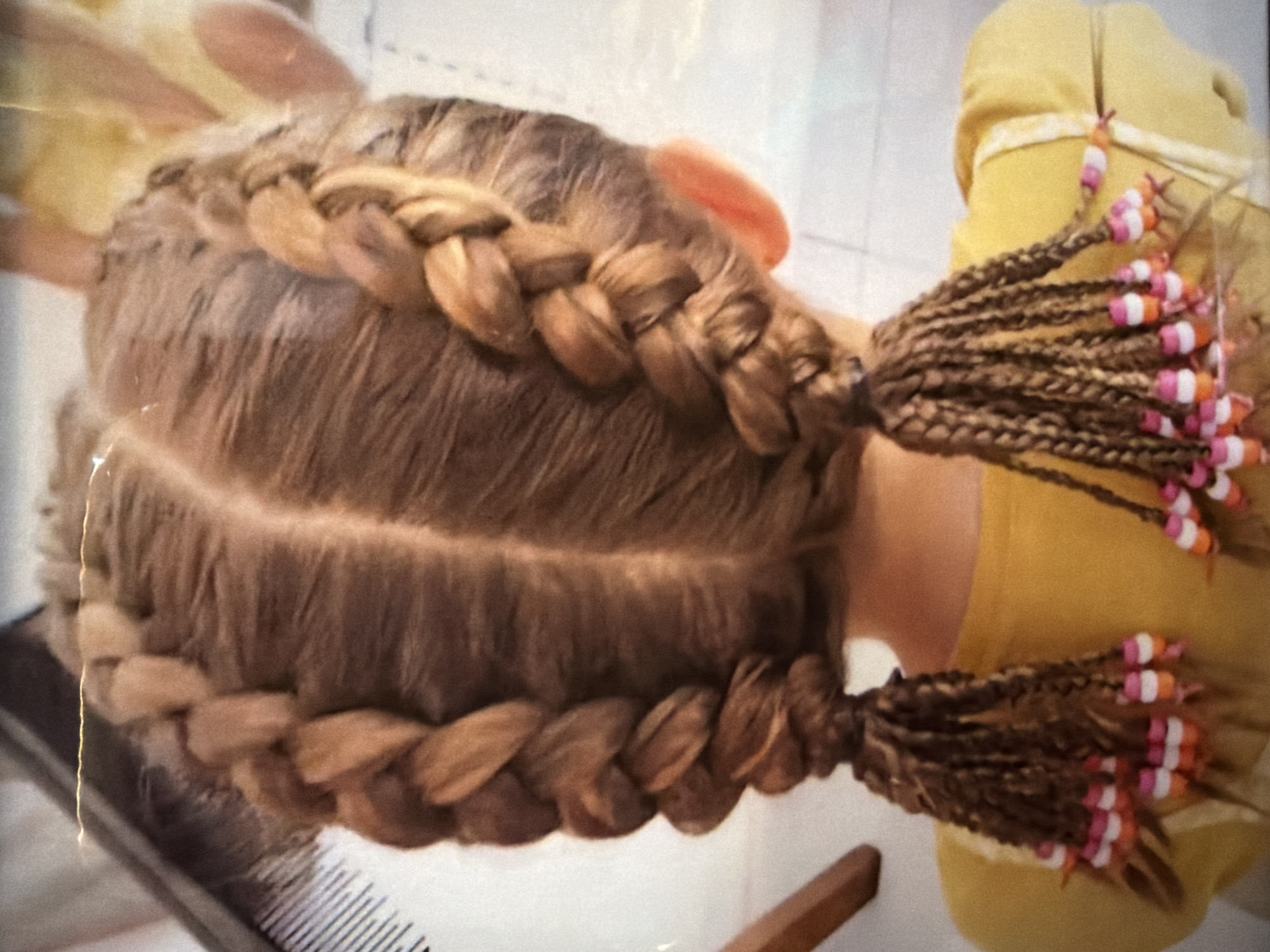Hair braiding session with fish tank interaction in Kuta Selatan