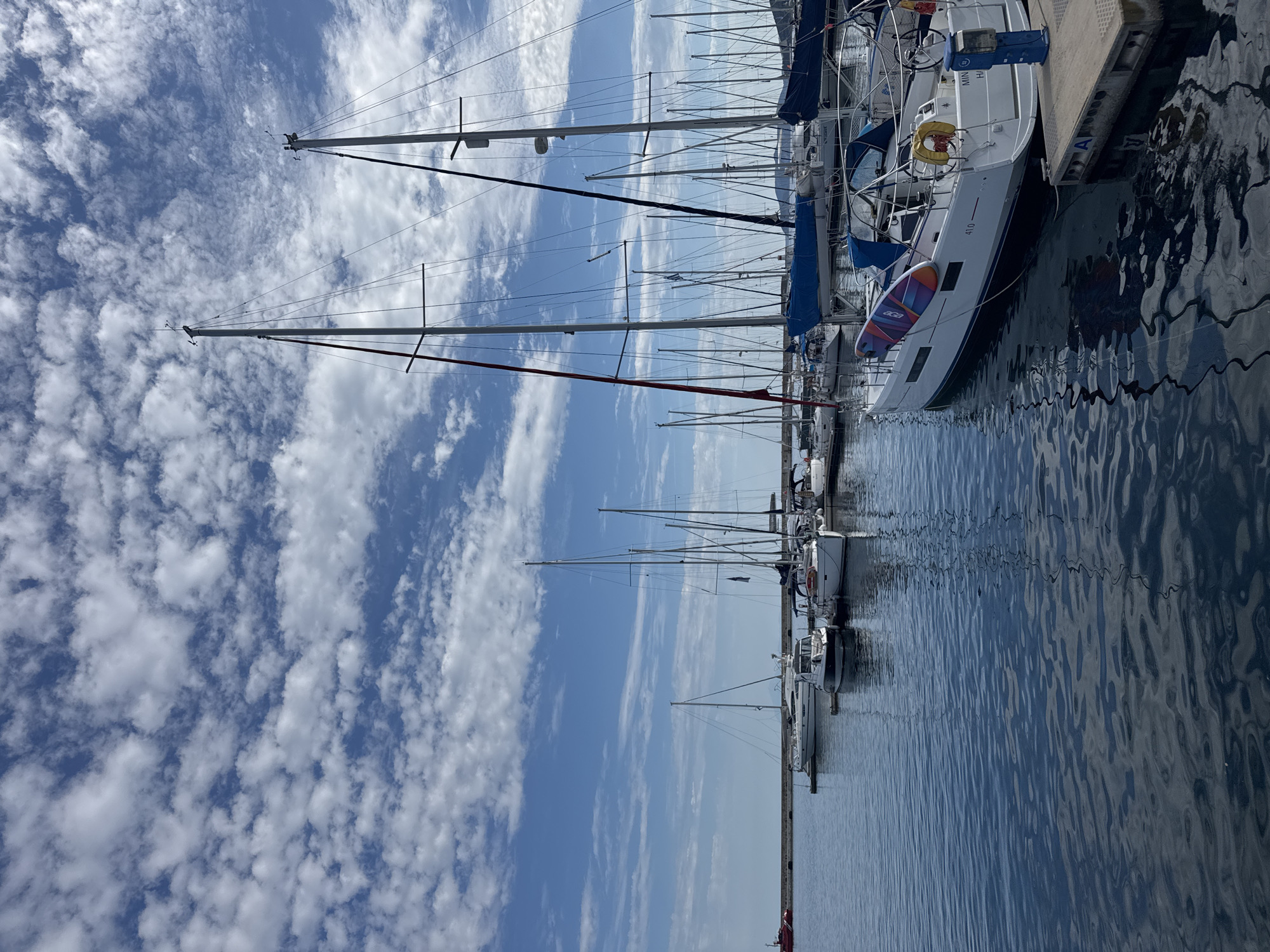 Sightseeing through a Greek coastal city's landmarks and harbor