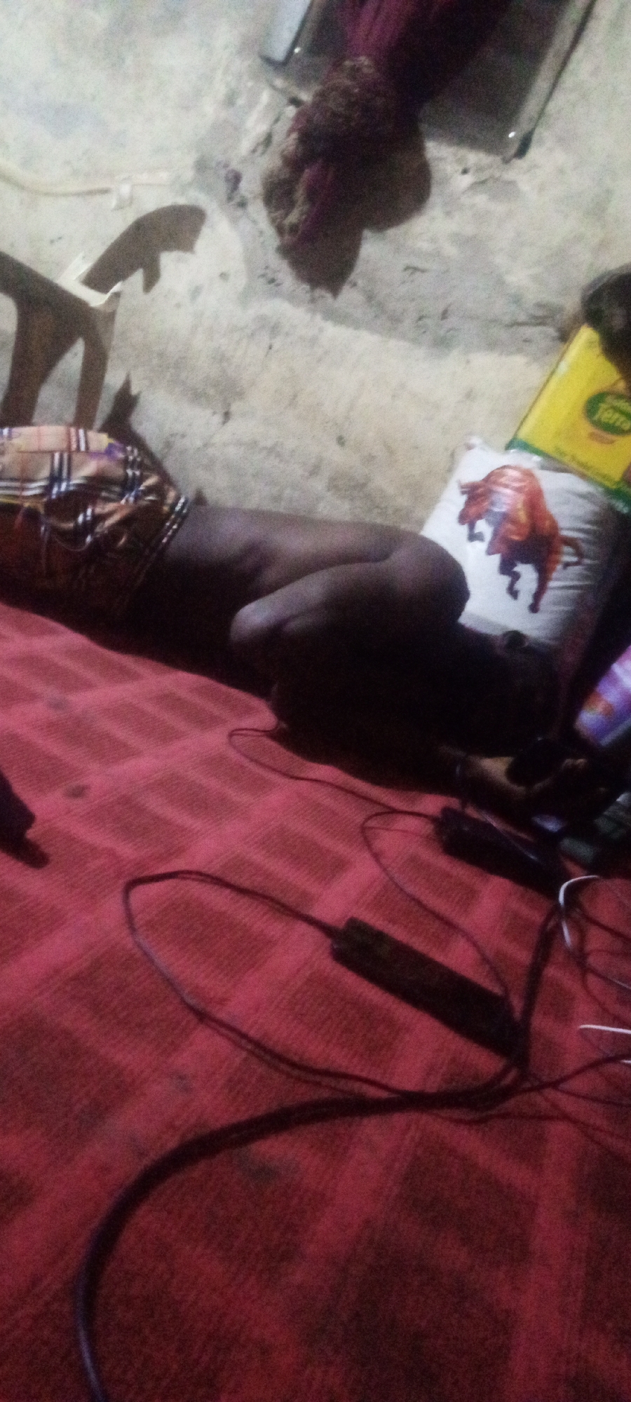 Person rests on mat in Sabon Tasha home