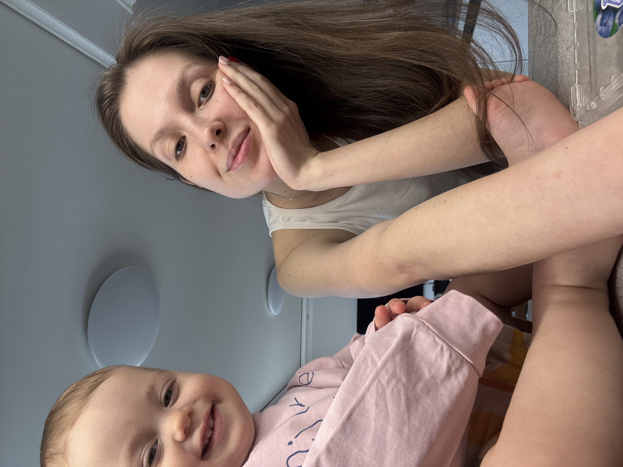 Mother and toddler share playful moments in Moscow home