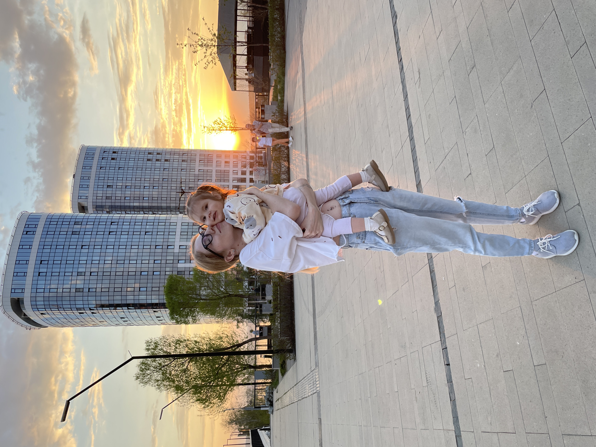 Mother and child enjoy afternoon activities in Izhevsk plaza