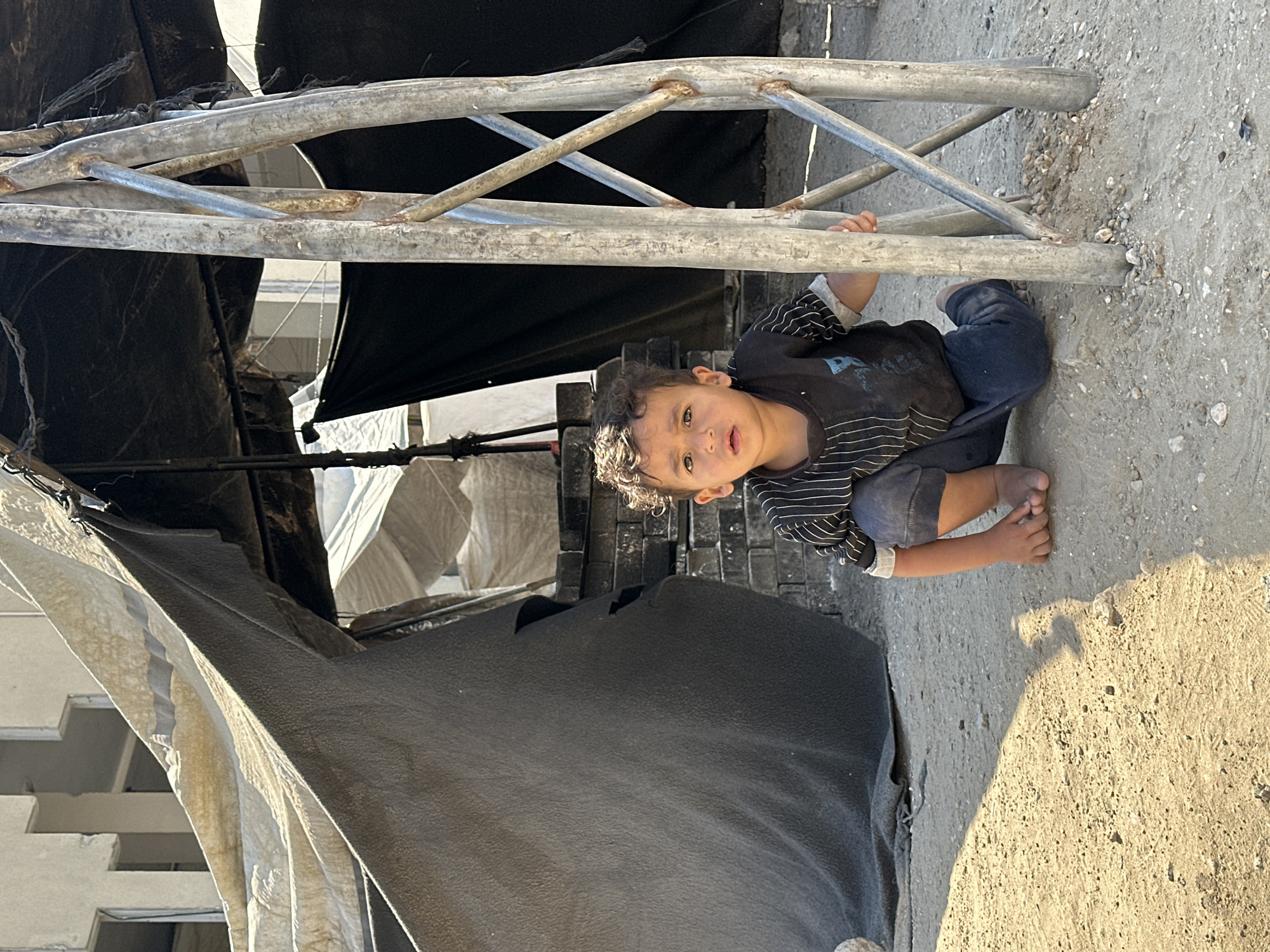 Children navigate daily life in Gaza displacement camps