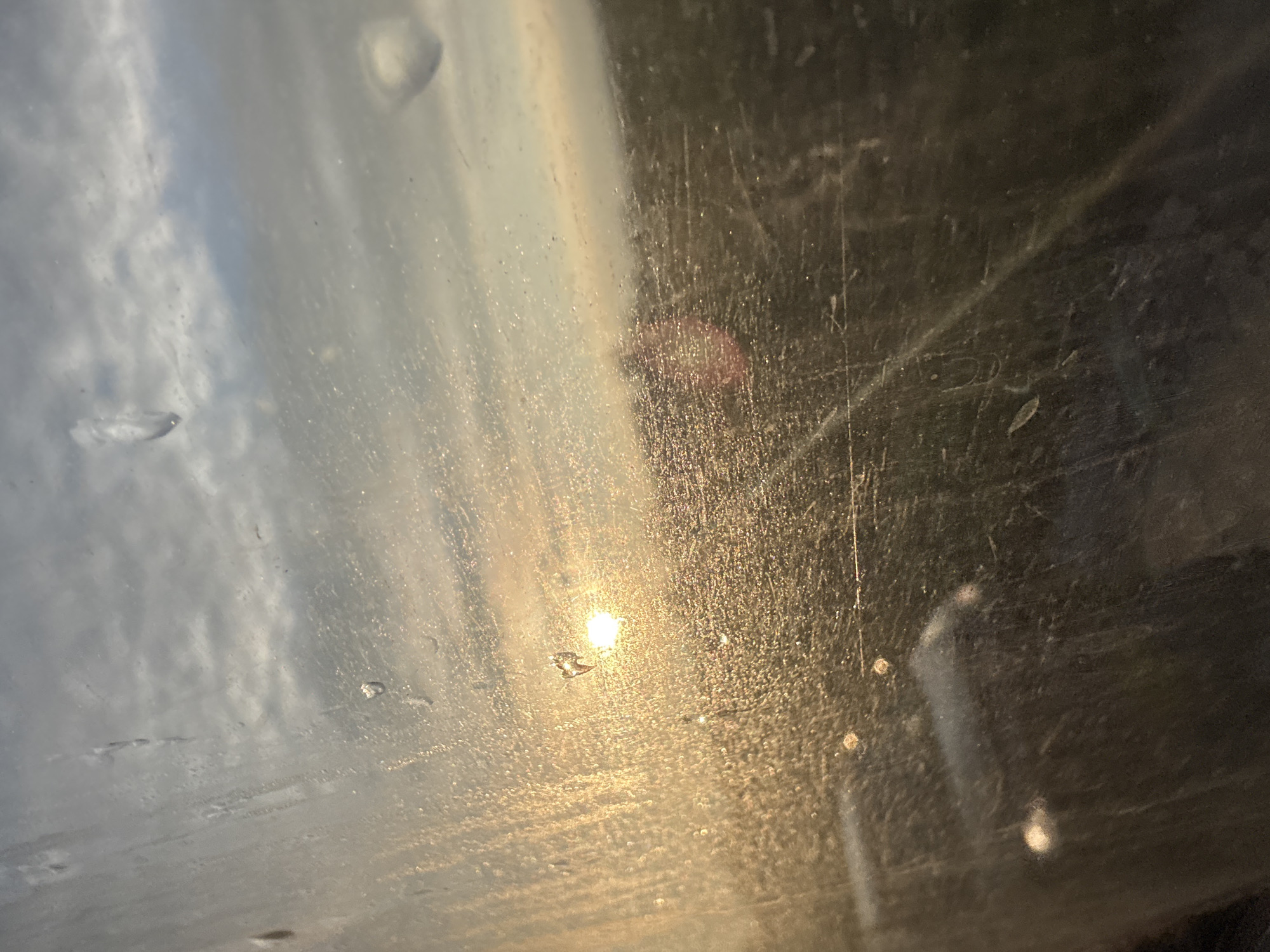 Dawn view through dirty vehicle window in Bulgaria