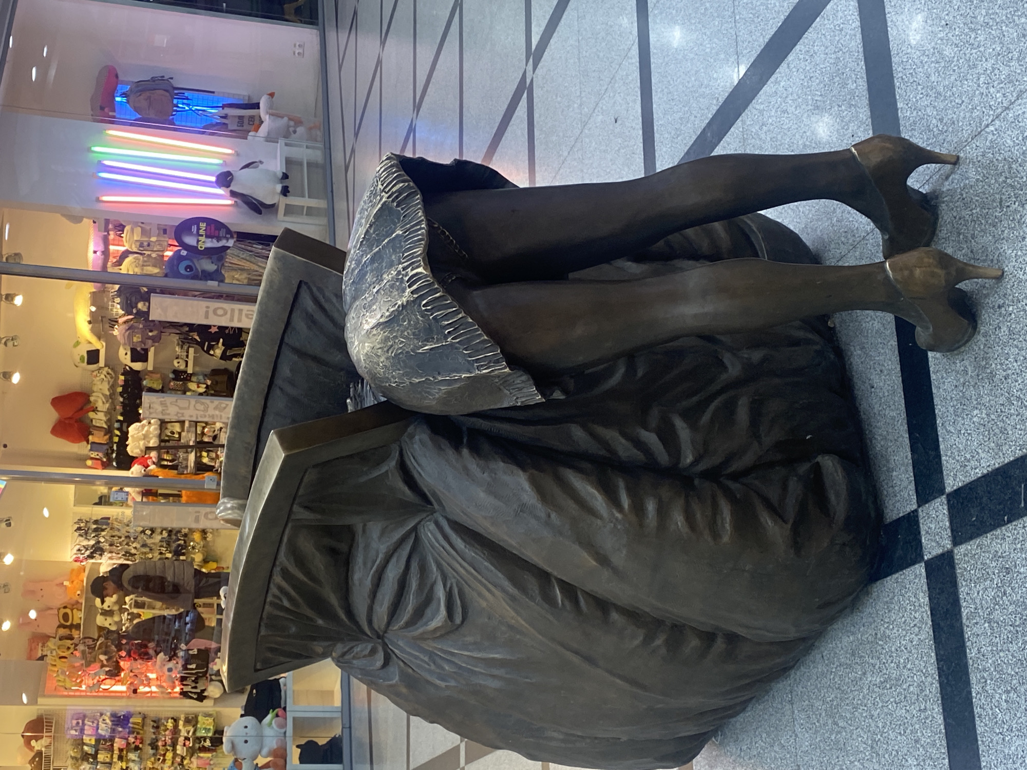 Bronze sculptures and vintage truck display in Yekaterinburg mall