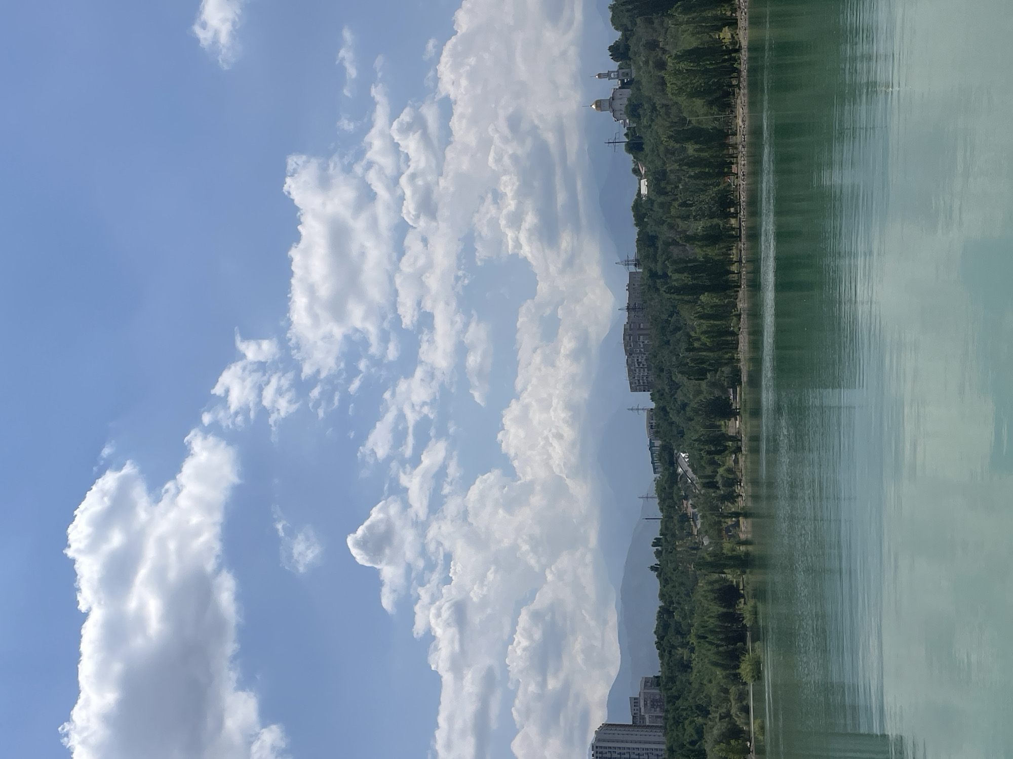 Big Almaty Lake glows turquoise under a clear summer sky